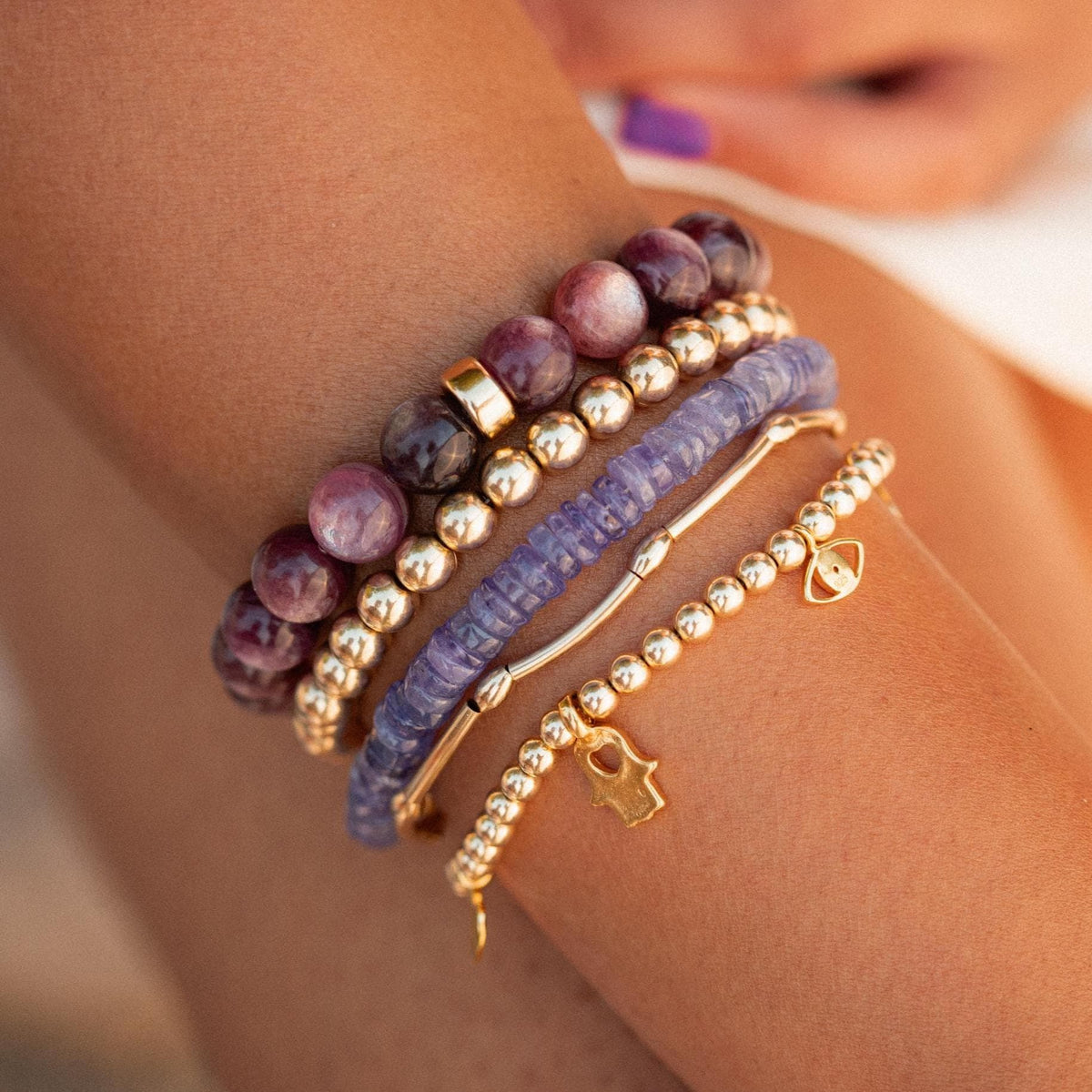 Elegant Tanzanite bracelet by Earthly Abundance Jewelry featuring deep blue gemstones on a delicate silver chain.
