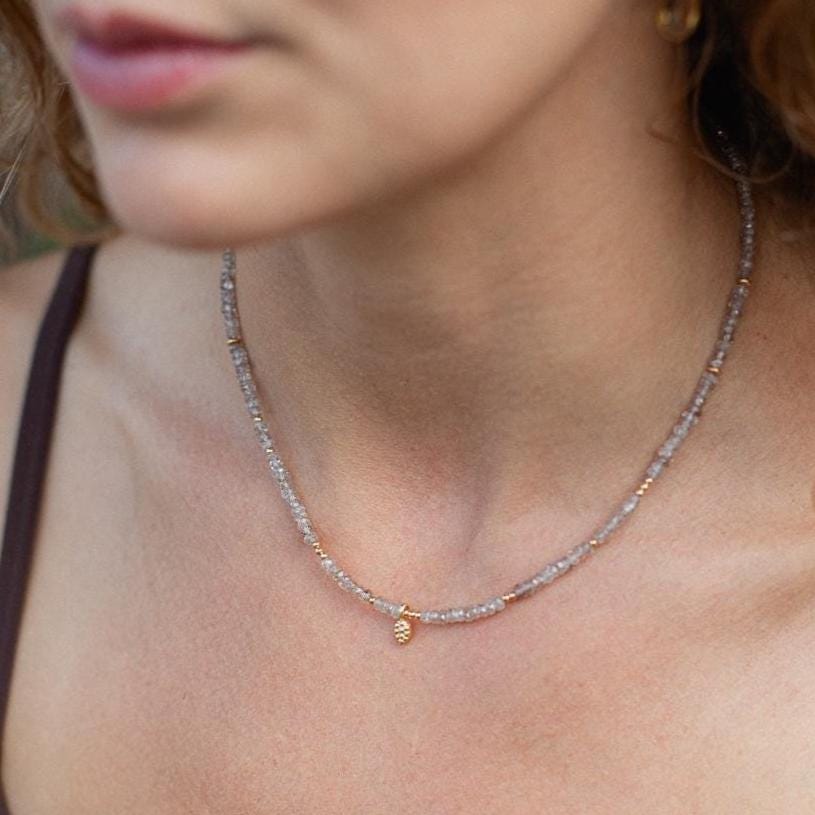 Elegant Earthly Abundance Timeless Radiance Zircon necklace with sparkling clear zircon stones on a delicate chain.