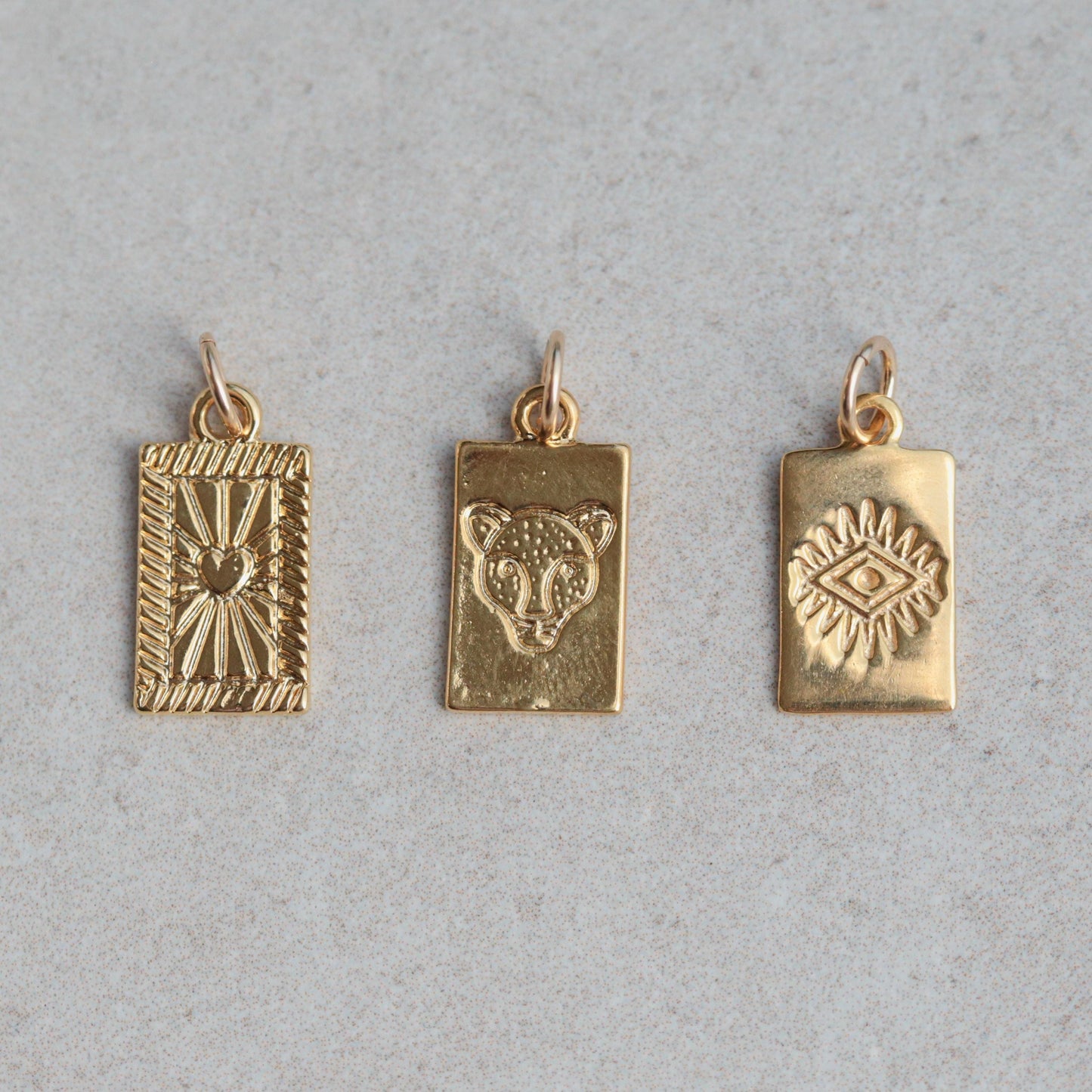 Gold vermeil pendant from Earthly Abundance featuring a detailed, elegant design on a delicate chain.