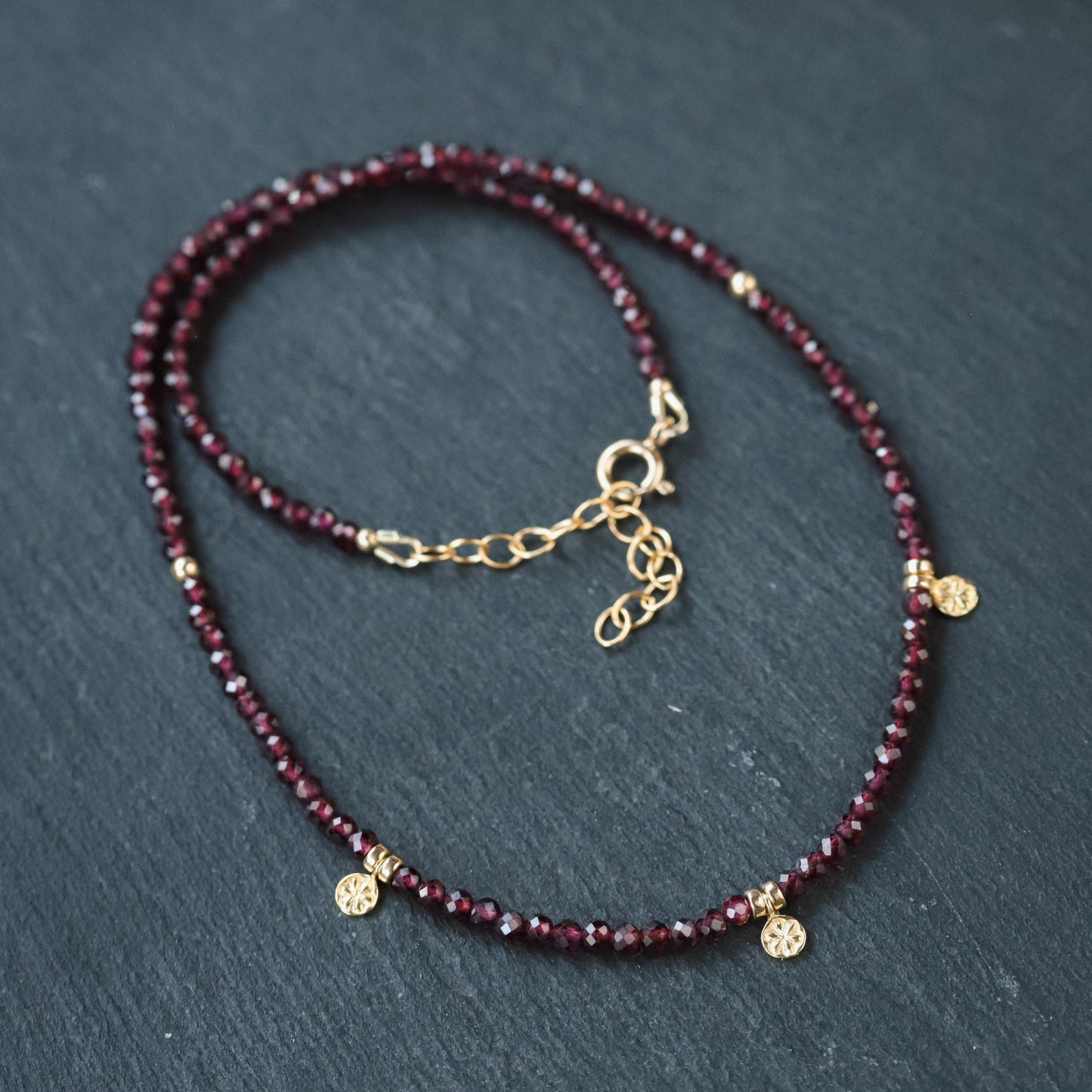 Earthly Abundance Jewelry garnet beaded necklace featuring deep red gemstone beads on a delicate strand.