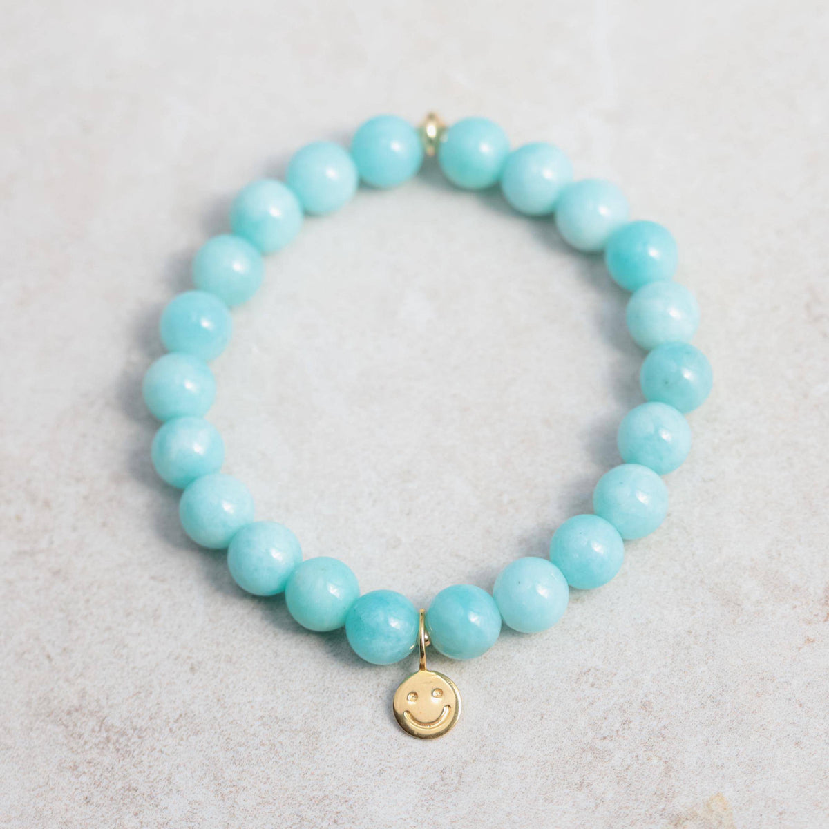 Peruvian Amazonite bracelet featuring polished blue-green stones from Earthly Abundance on a white background.