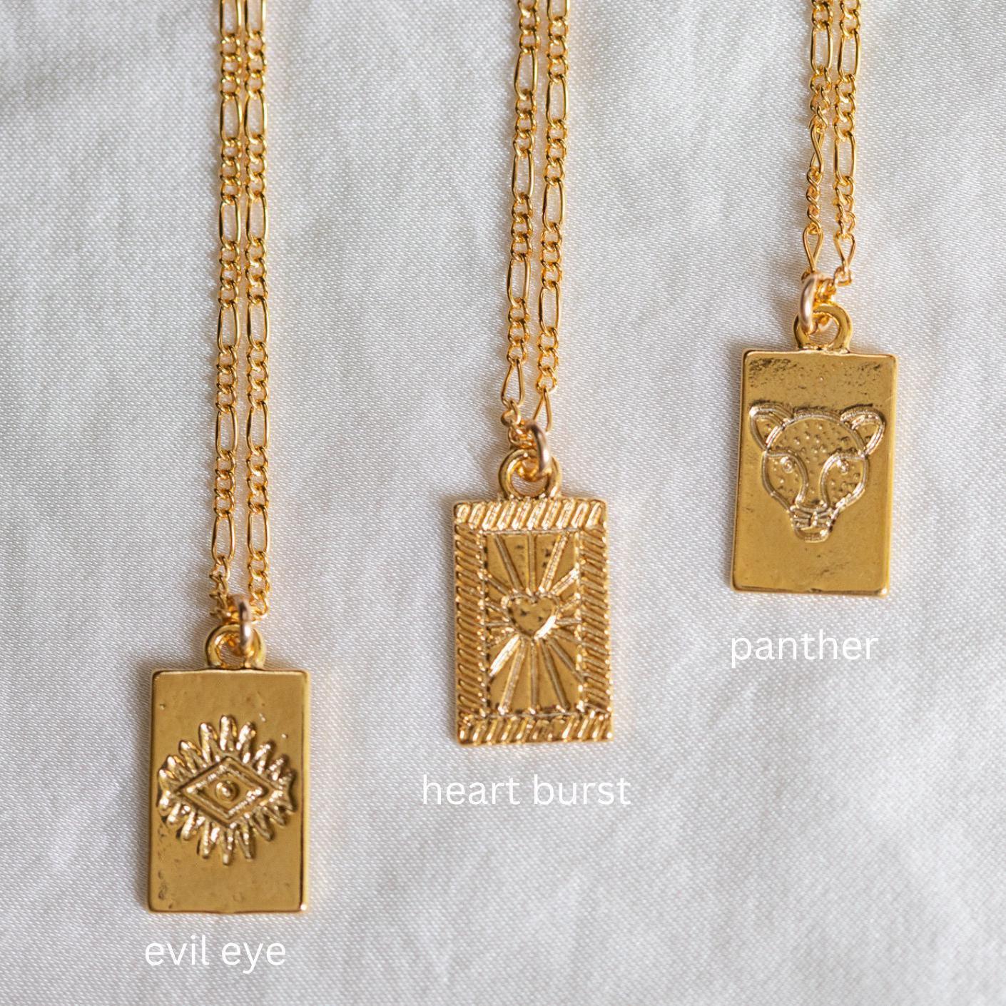 Gold vermeil pendant from Earthly Abundance featuring a detailed, elegant design on a delicate chain.
