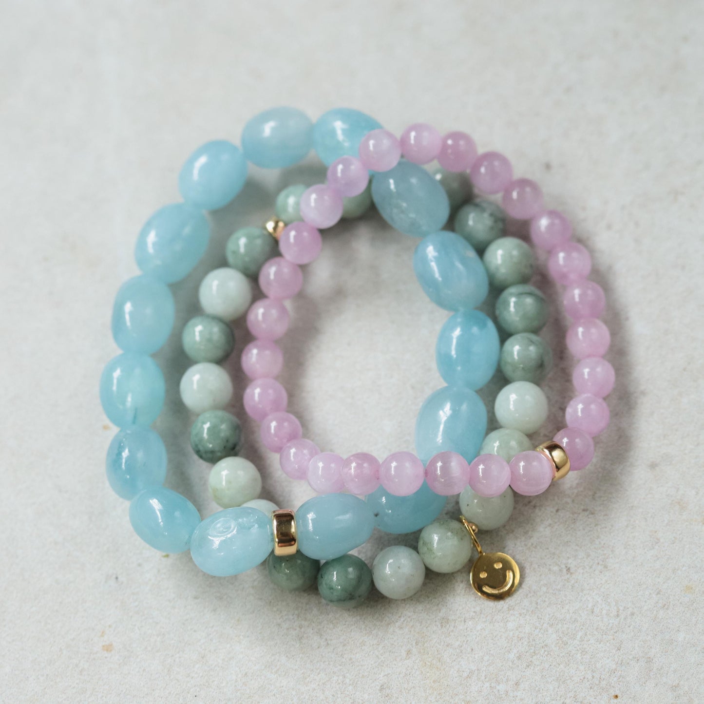 Kunzite bracelet with 7mm beads from Earthly Abundance, showcasing pink-purple gemstones on a delicate jewelry strand.