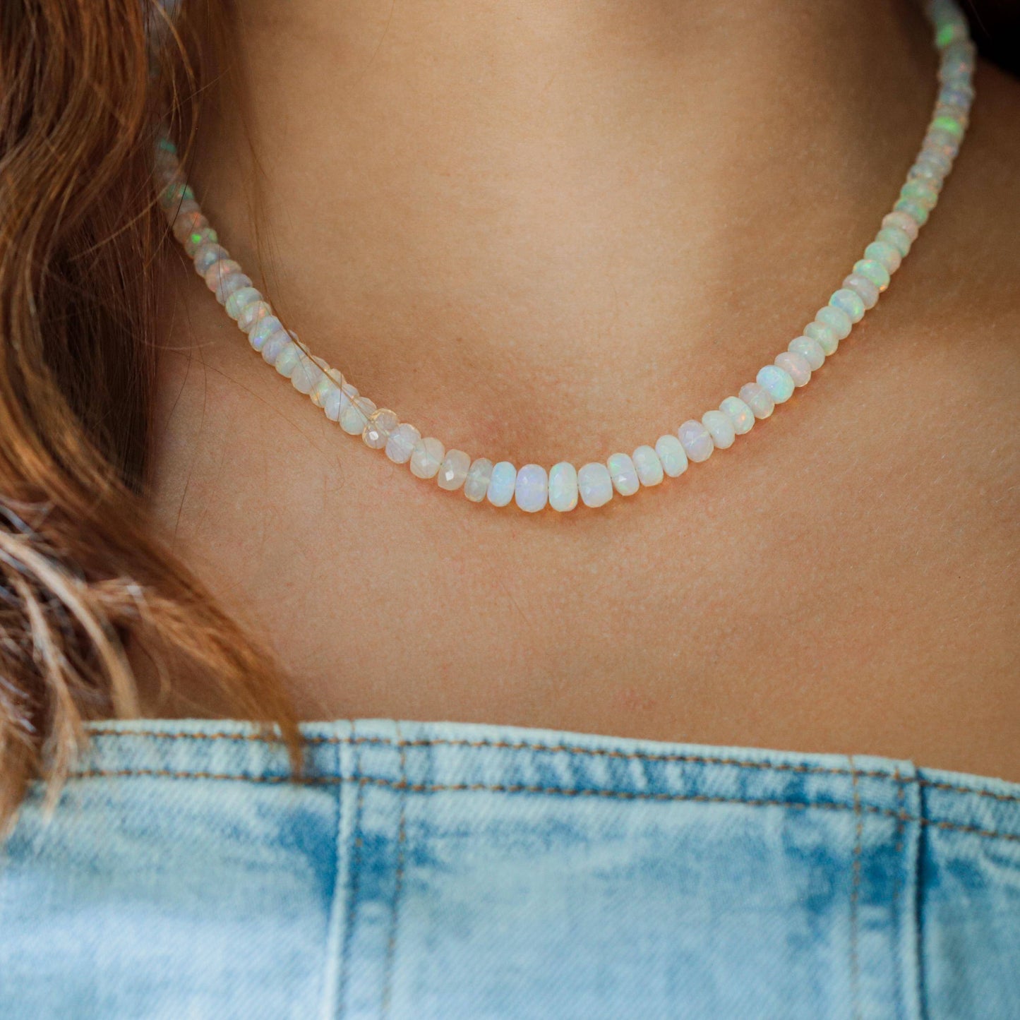 Ethiopian Opal beaded necklace with multicolored gemstones, handcrafted by Earthly Abundance, displayed on a neutral background.