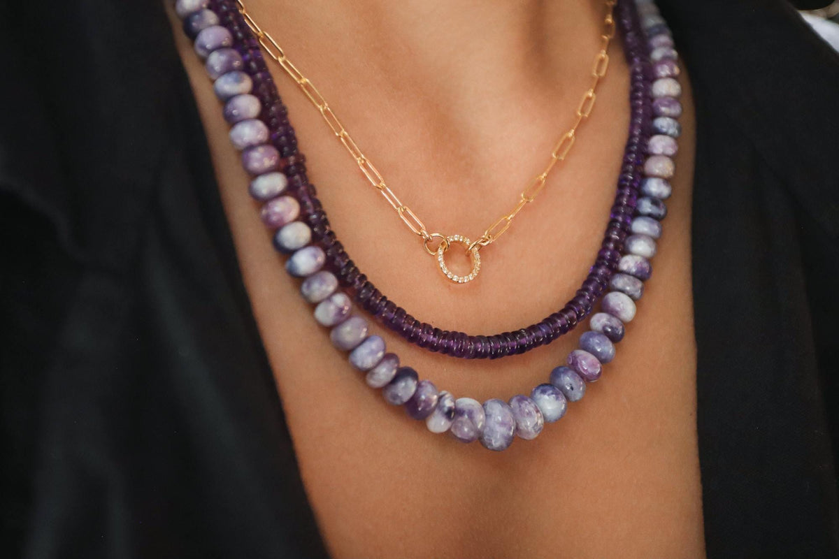 Elegant Tiffany purple opal necklace in 14K gold from Earthly Abundance, showcasing a vibrant purple opal pendant on a delicate gold chain.