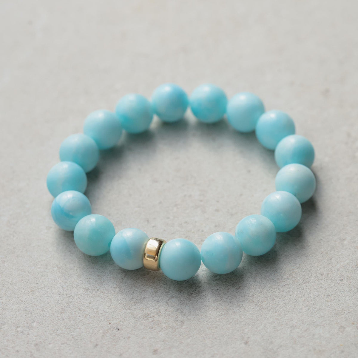 Marisol Hemimorphite bracelet with 14K gold accents by Earthly Abundance, showcasing vibrant blue-green stones and elegant design.
