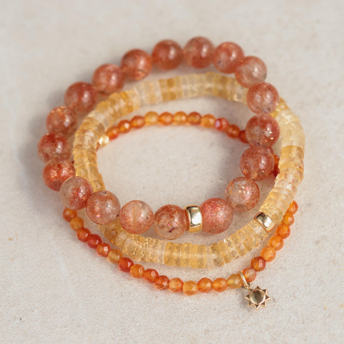 Small Carnelian pendant in 14K gold setting from Earthly Abundance, showcasing a vibrant orange gemstone on a delicate chain.