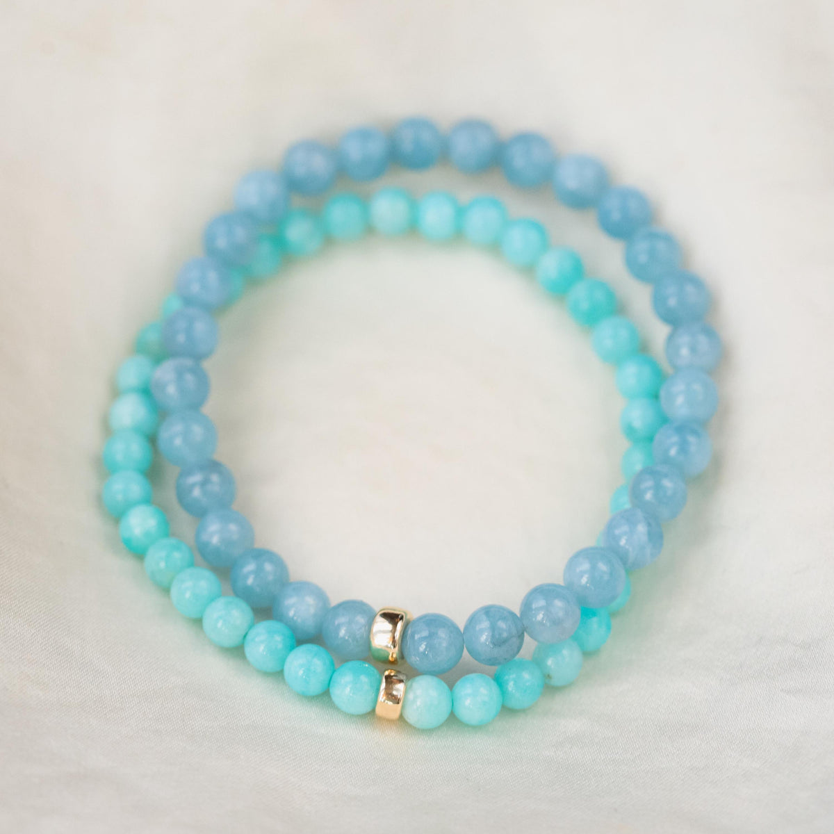 Peruvian Amazonite bracelet with polished blue-green stones and silver accents, showcasing natural gemstone beads.