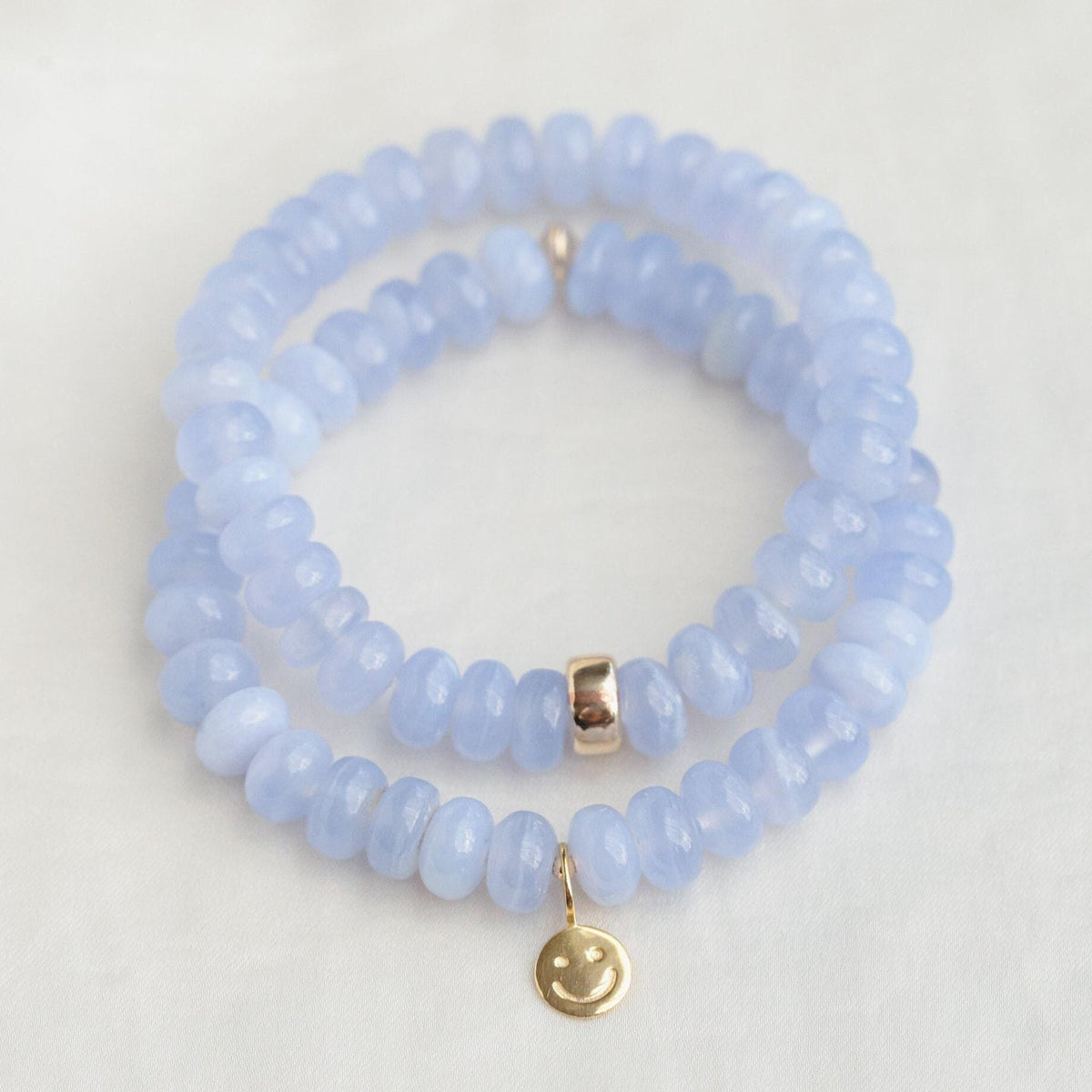 Blue Lace Agate Cloudlight bracelet from Earthly Abundance featuring smooth, polished beads with a calming blue hue.