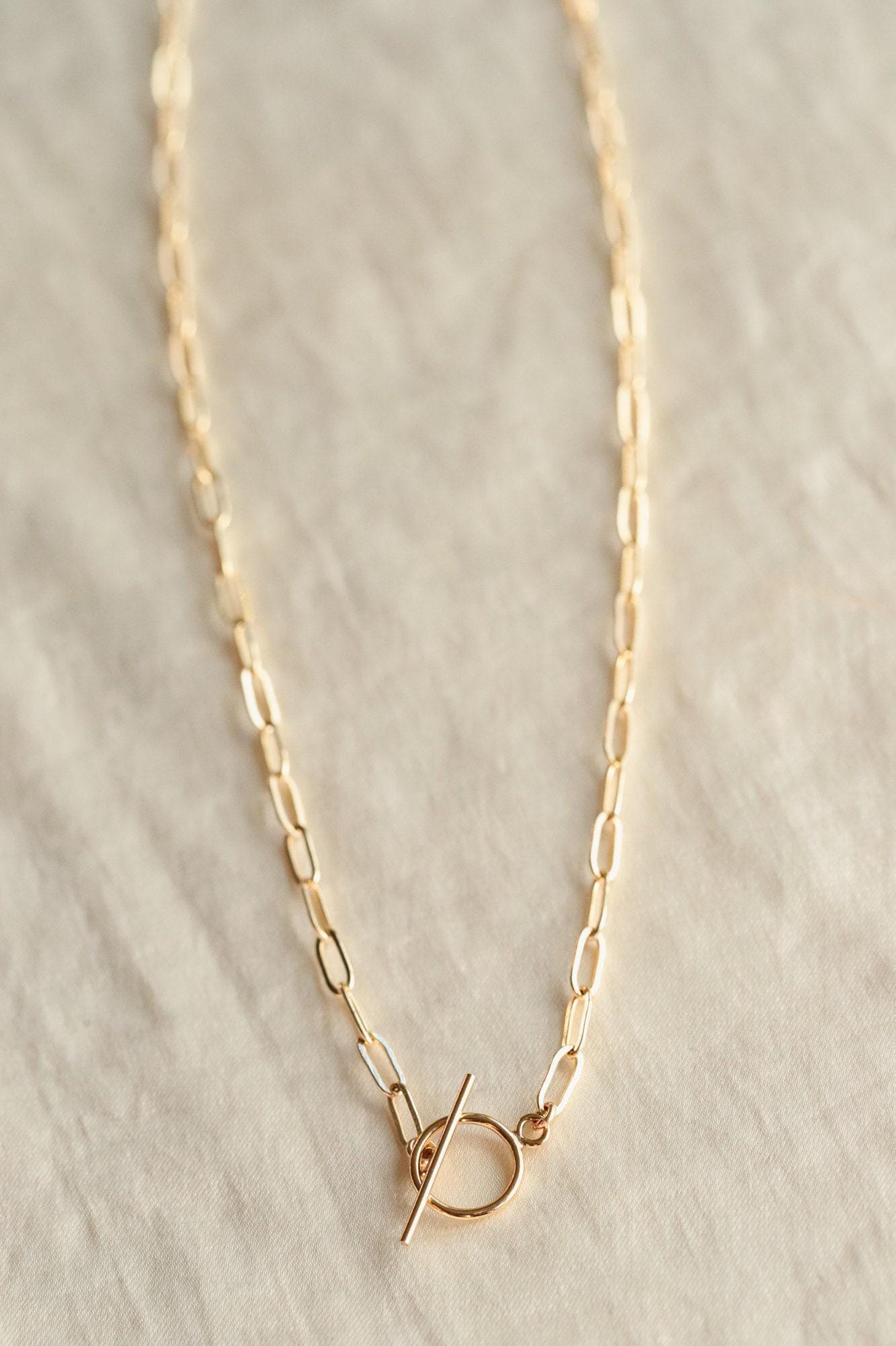 14K gold filled everyday necklace from Earthly Abundance featuring a simple, elegant gold chain on a neutral background.