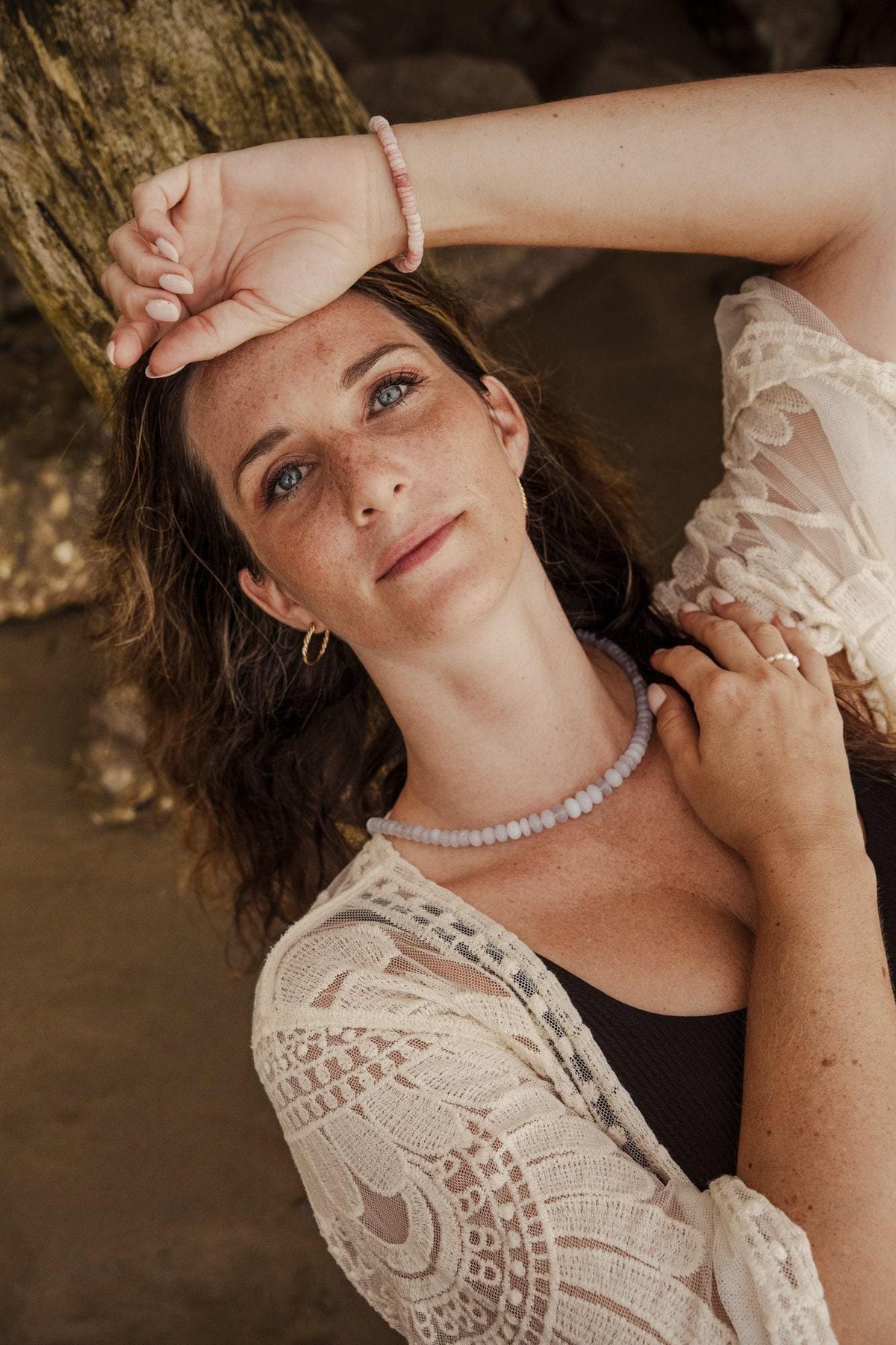 Lavender Chalcedony necklace by Earthly Abundance featuring a smooth, oval purple gemstone pendant on a silver chain.