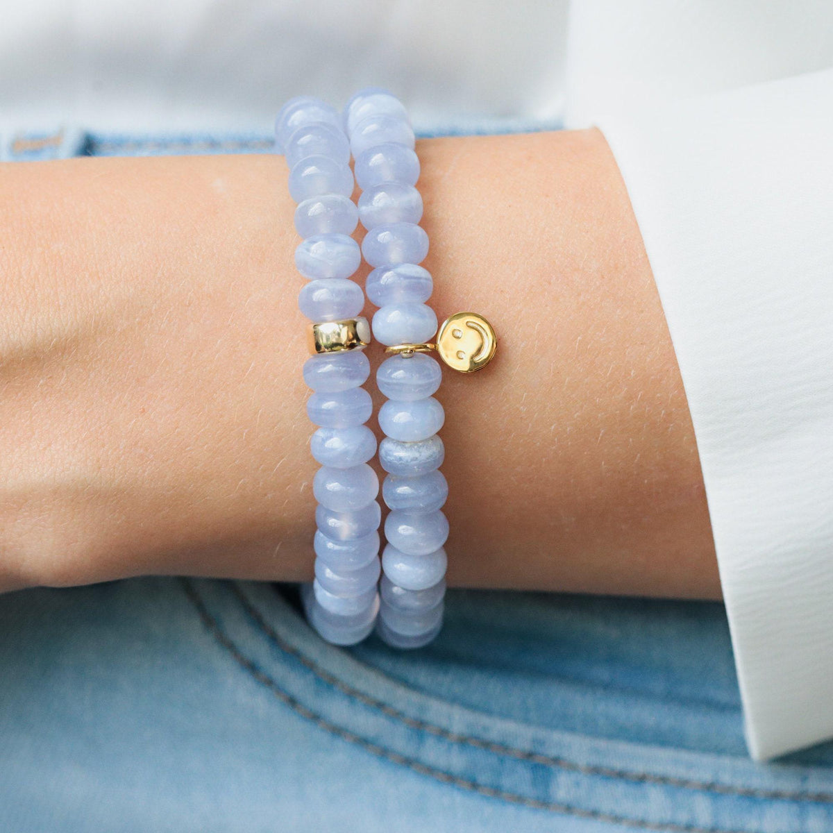 Blue Lace Agate Cloudlight bracelet from Earthly Abundance featuring polished blue gemstone beads on an elastic band.