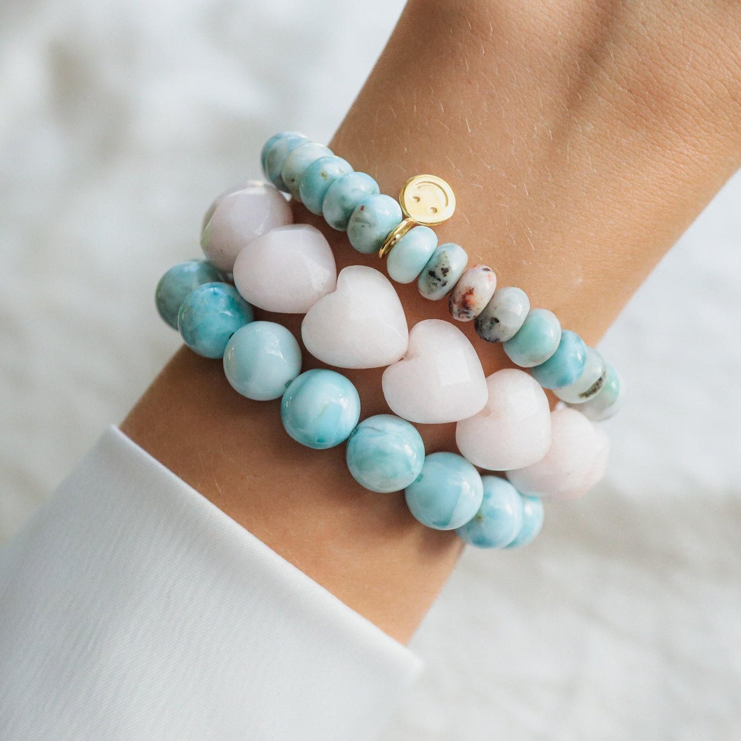 Larimar Depth Bracelet by Earthly Abundance featuring smooth blue larimar stones on a delicate silver chain.