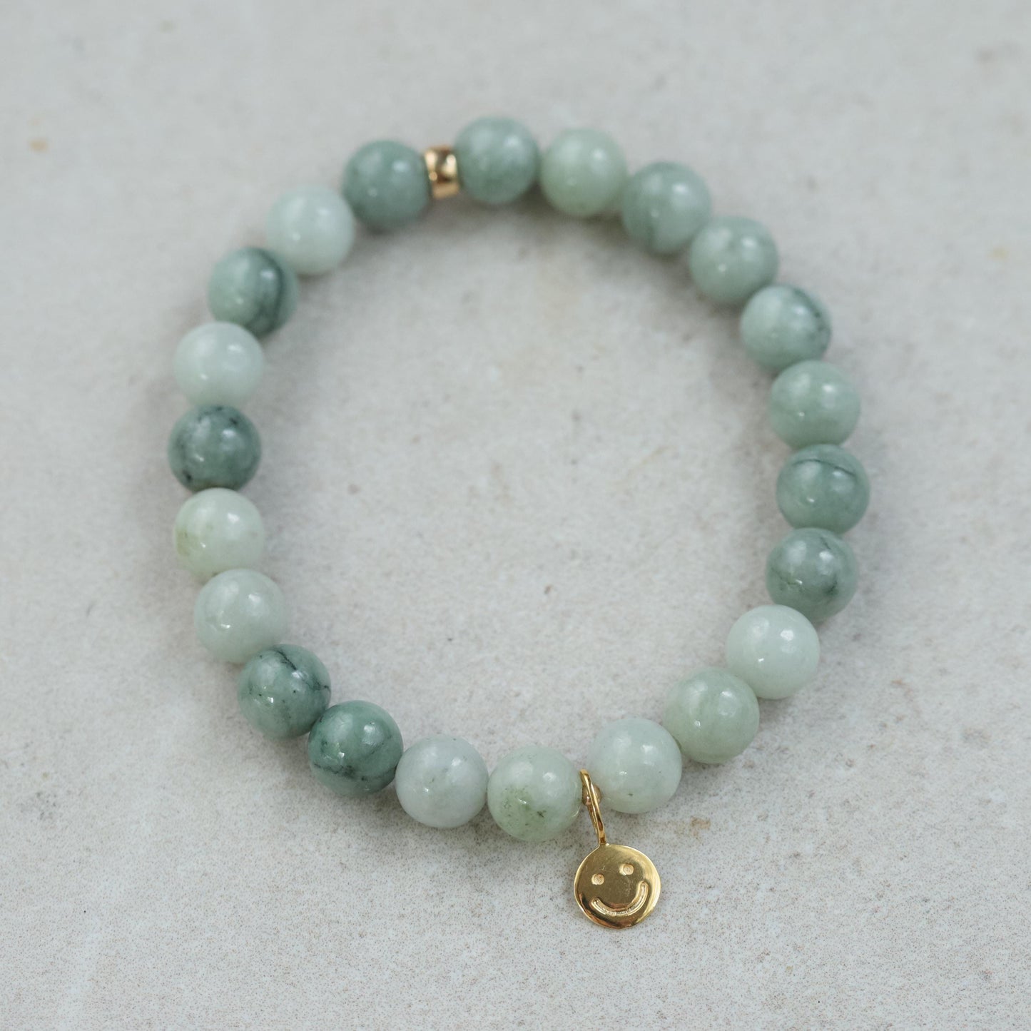 Burmese Jade 8mm gemstone beads from Earthly Abundance, showing smooth, polished jade spherical beads for jewelry making.