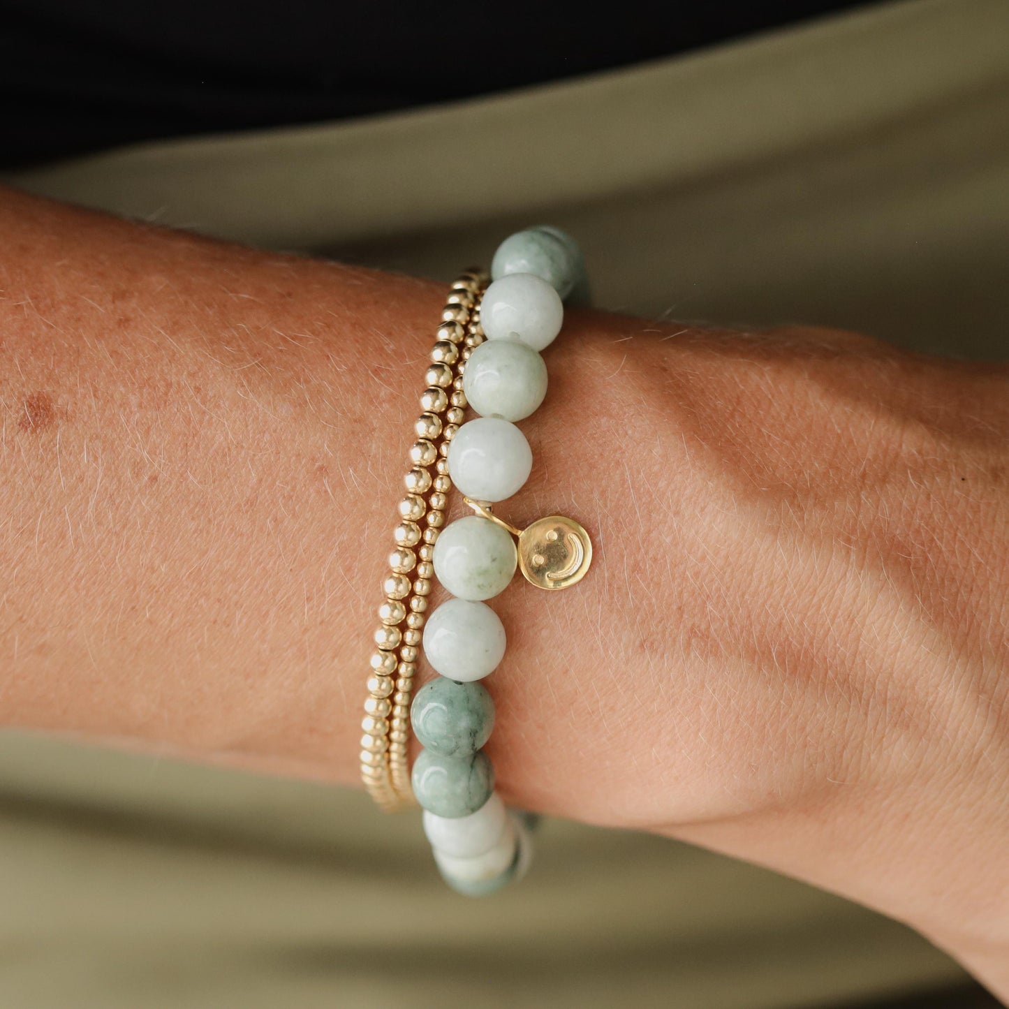 8mm Burmese Jade gemstone bead strand from Earthly Abundance, showcasing smooth, polished green jade with natural variations