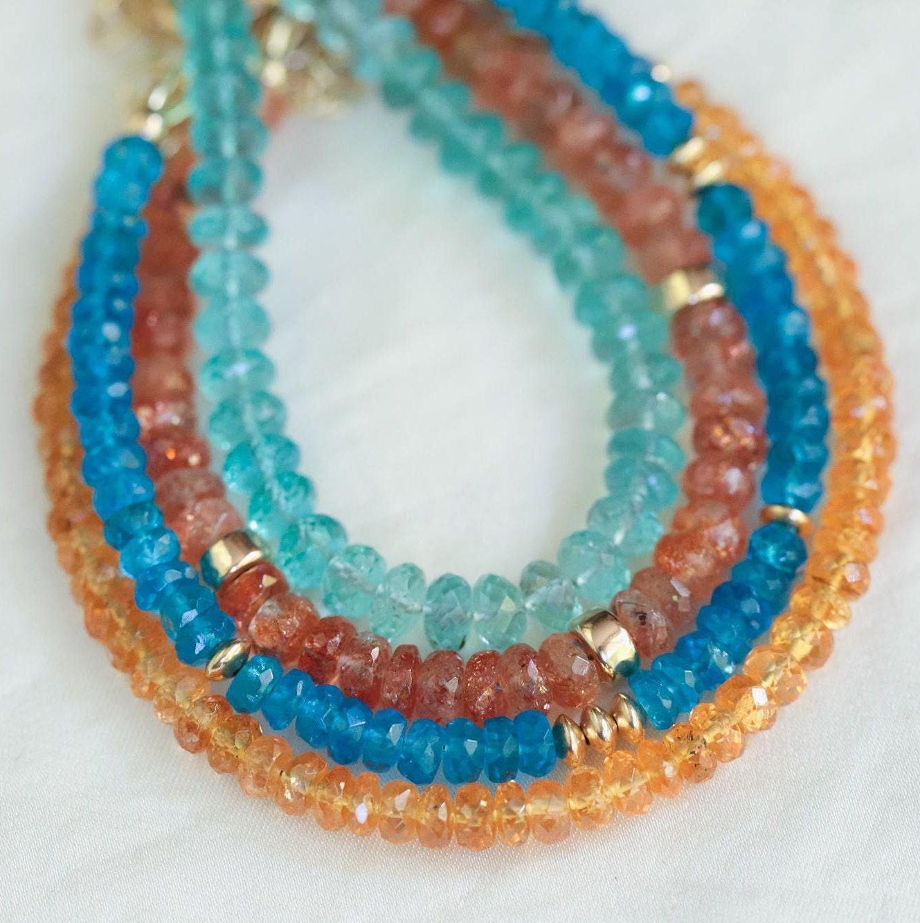Spessartite Garnet bracelet by Earthly Abundance featuring vibrant orange-red gemstones on a delicate silver chain.
