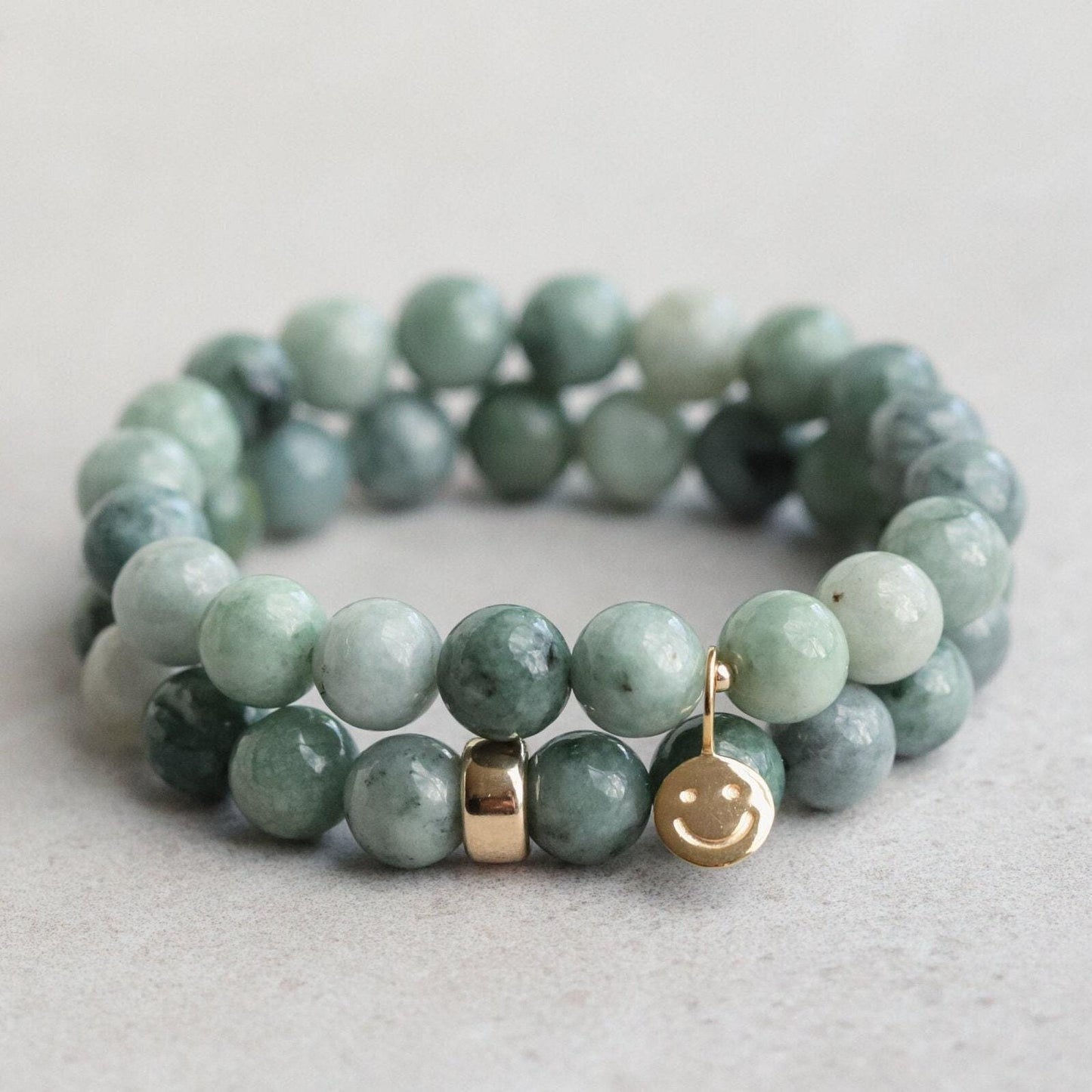 Burmese Jade 8mm gemstone beads from Earthly Abundance, showcasing smooth, polished green jade spherical beads for jewelry making.