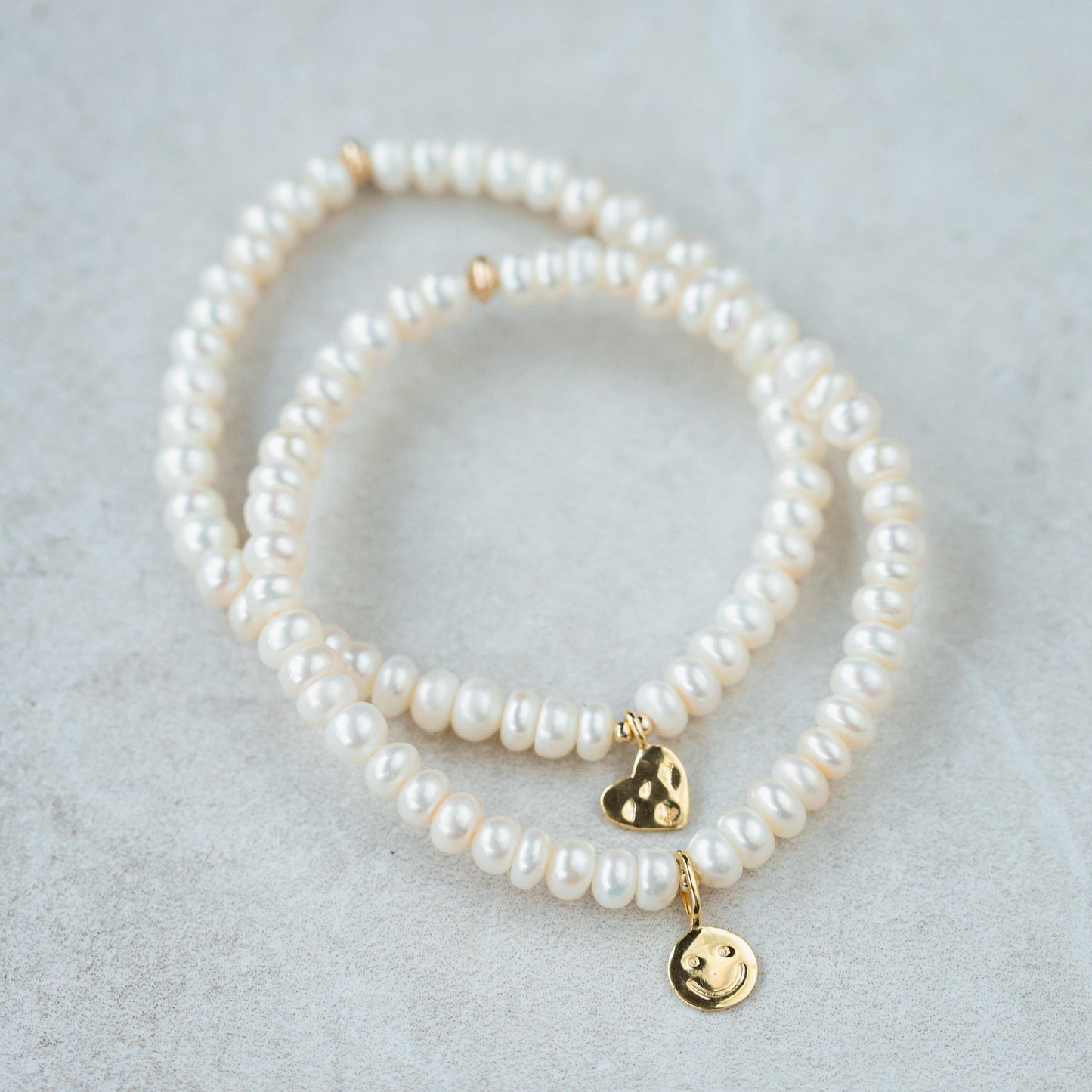 Freshwater Pearl bracelet by Earthly Abundance featuring lustrous white pearls on a delicate string.