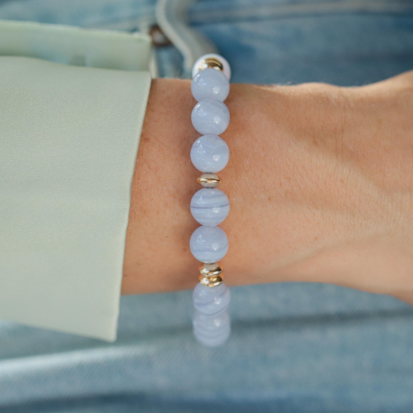 Blue lace and waves bracelet by Earthly Abundance featuring intricate lace design and wave-shaped accents in a vibrant blue color.