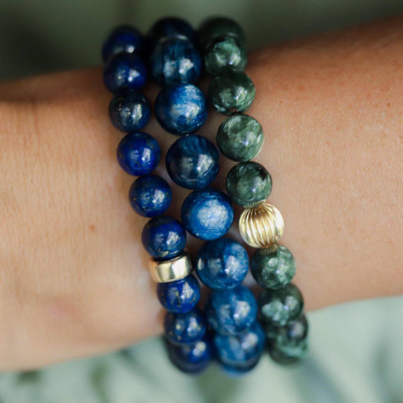 8mm Seraphinite gemstone bead strand from Earthly Abundance Jewelry showing deep green and silver chatoyancy.