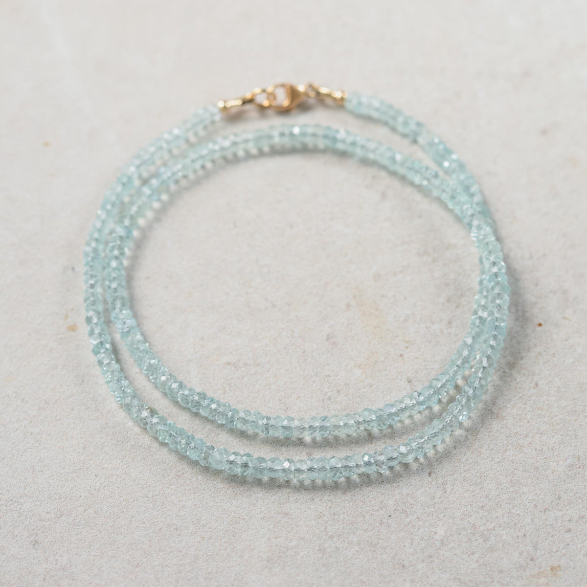 Aquamarine choker necklace with a silver chain and aquamarine gemstone pendant, designed by Earthly Abundance.