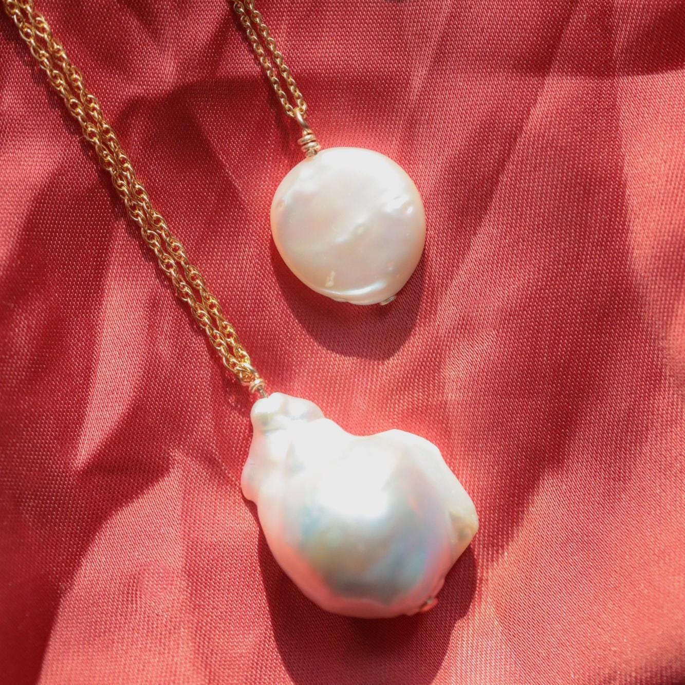Elegant Baroque Pearl necklace by Earthly Abundance Jewelry featuring irregular freshwater pearls on a delicate chain.