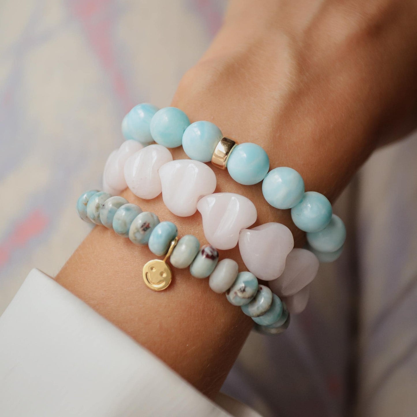 Pink mango calcite heart-shaped bracelet from Earthly Abundance Jewelry, featuring smooth, polished stones on an elastic band.