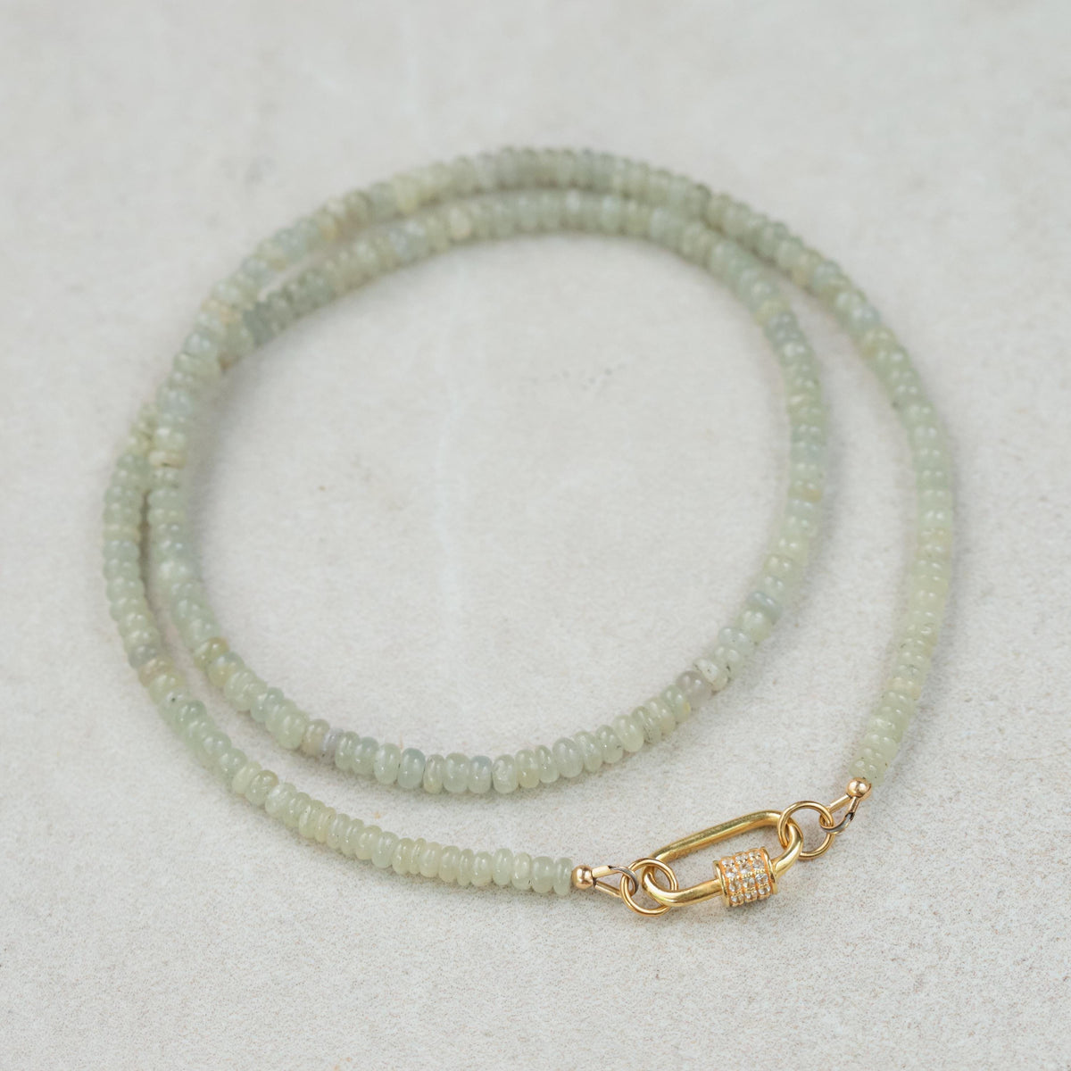 Grey Sapphire Topaz necklace with a silver chain, featuring a pendant with a large grey sapphire and topaz gemstones.
