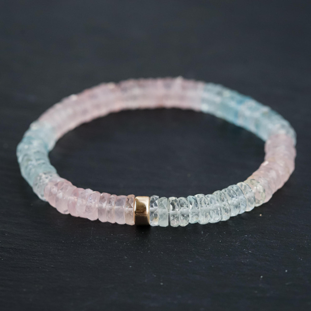 Pastel Morganite Beryl Heishi bracelet with round gemstone beads, featuring soft pink and peach tones, on a white background.
