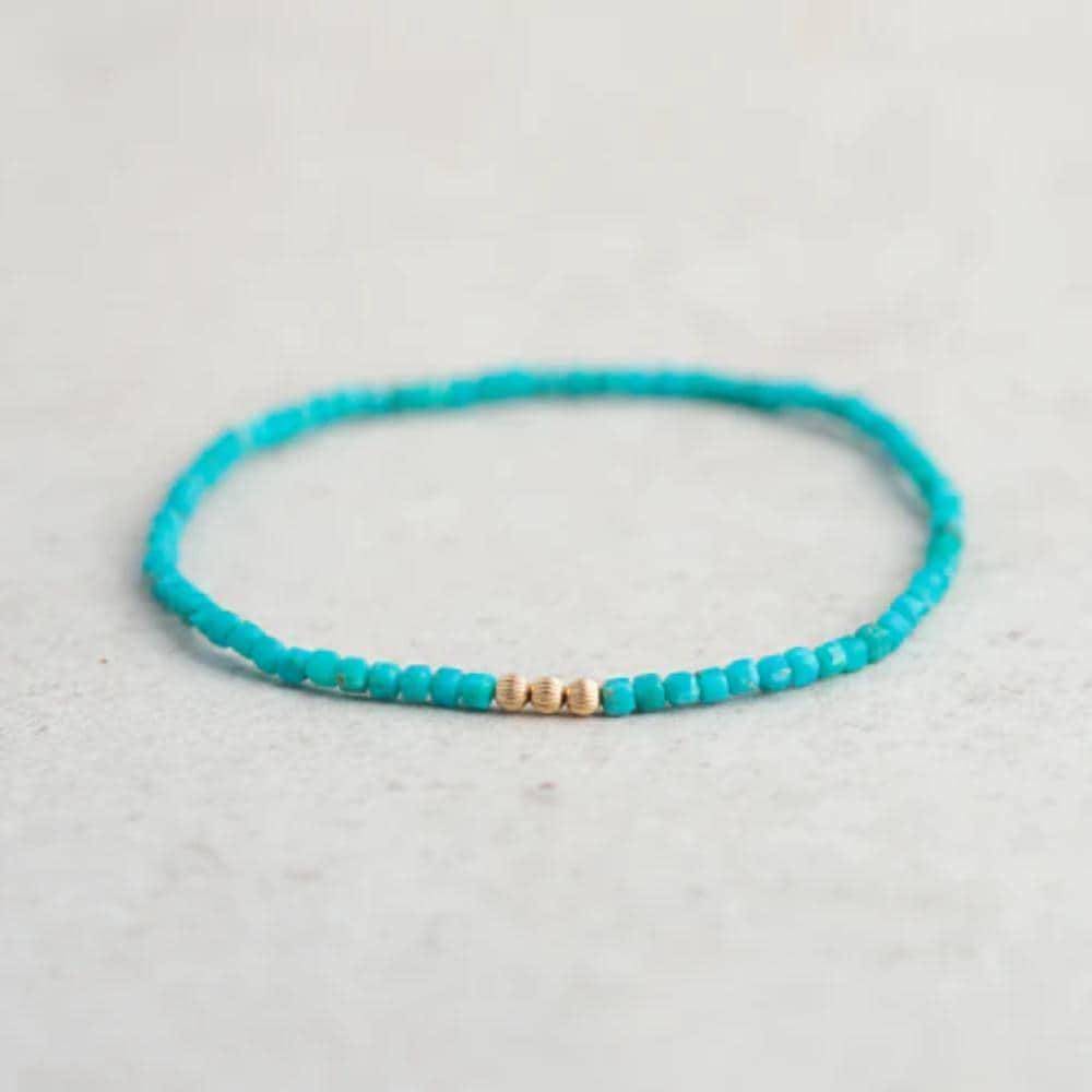 Turquoise beaded bracelet by Earthly Abundance featuring round beads and an adjustable clasp.