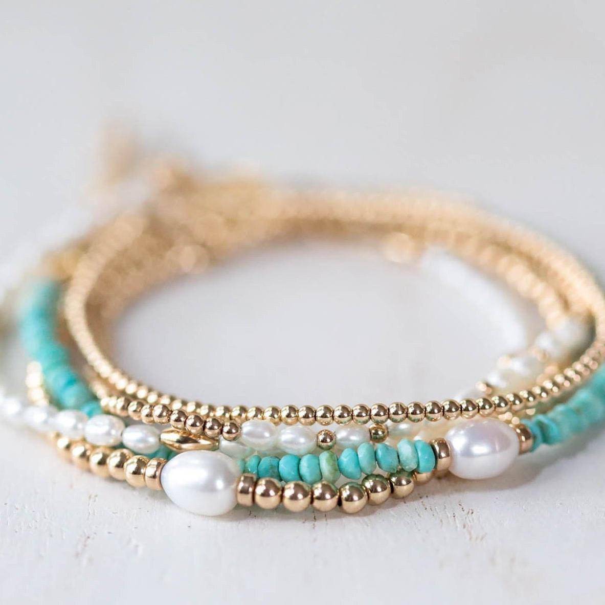 Freshwater pearl from Earthly Abundance Jewelry showcasing a smooth, lustrous white pearl on a delicate strand.