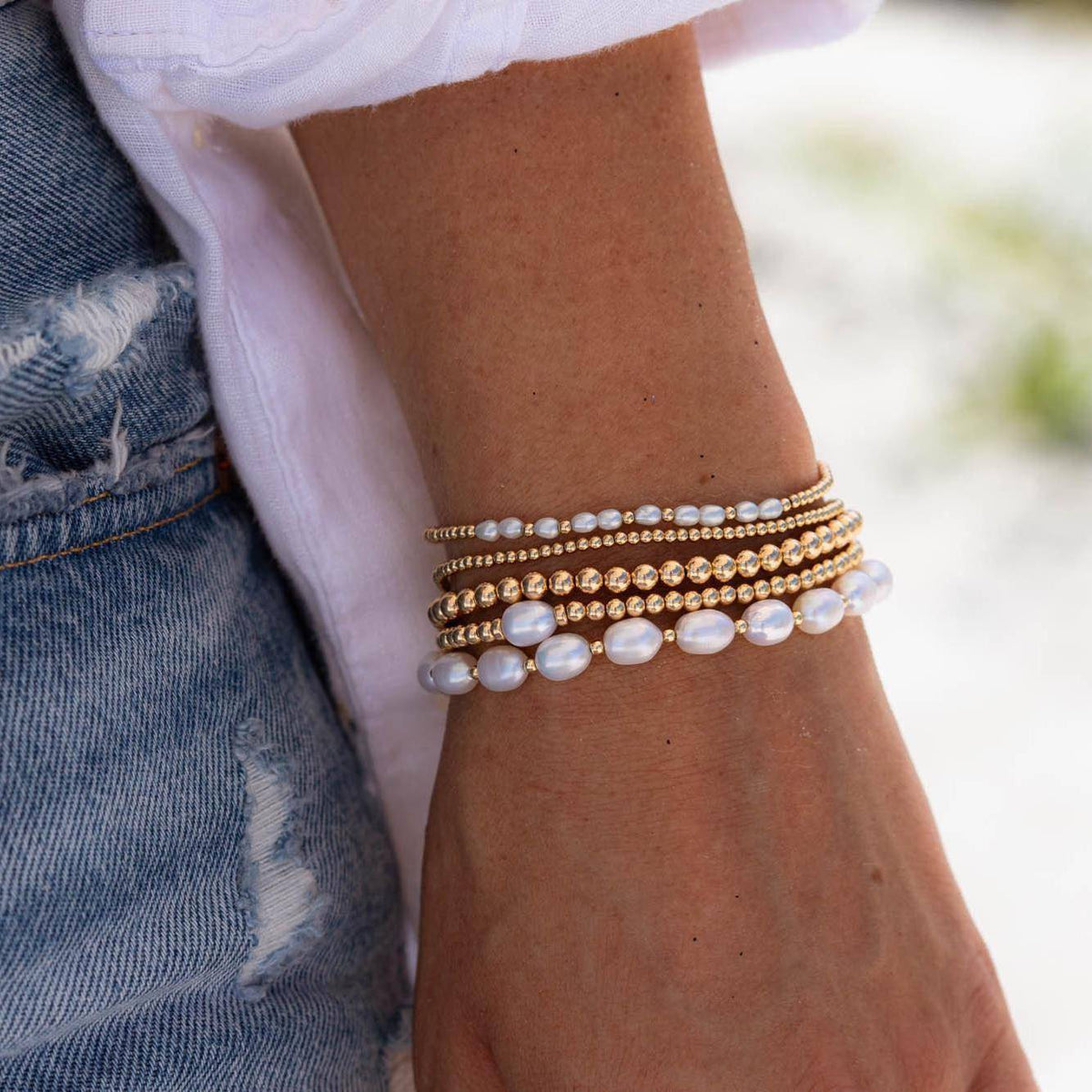 Elegant freshwater pearl from Earthly Abundance Jewelry, showcasing its smooth, lustrous surface and natural shape.