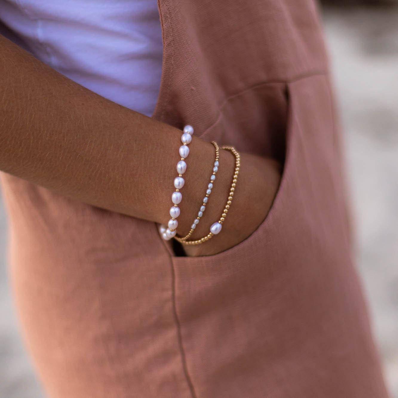 Freshwater pearl from Earthly Abundance Jewelry featuring a smooth, lustrous white pearl on a delicate necklace.