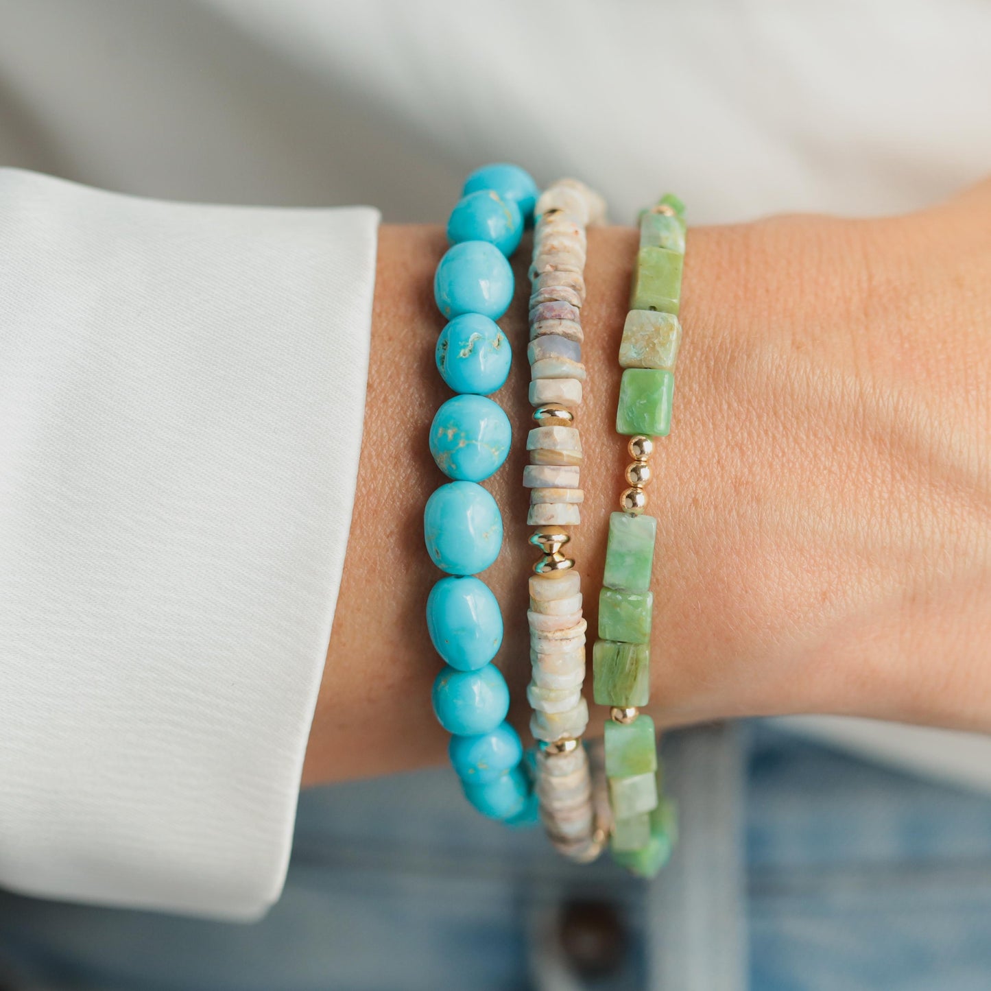 Australian Opal bracelet from Earthly Abundance featuring vibrant opal stones on a delicate silver chain.