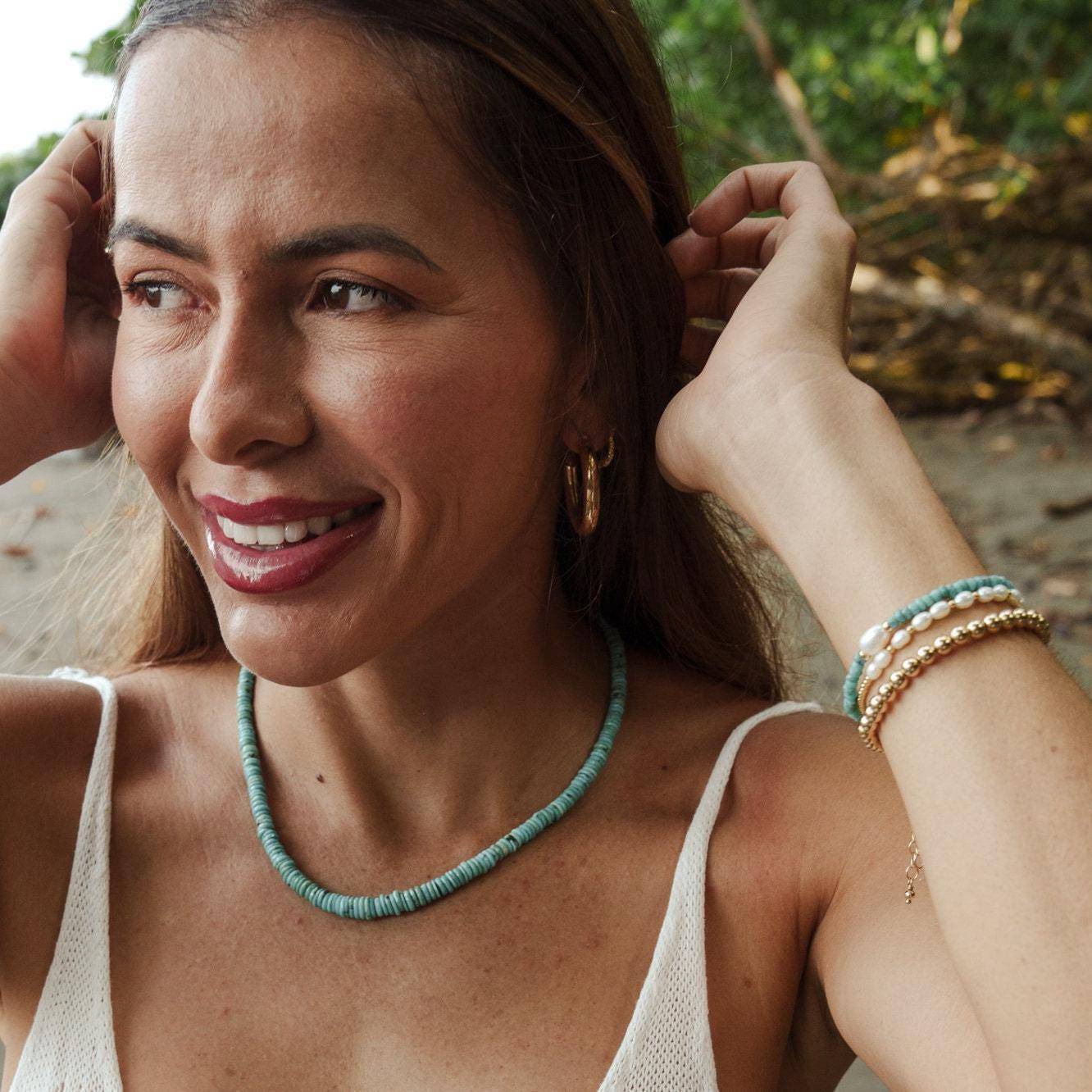 Freshwater pearl from Earthly Abundance Jewelry showcasing a lustrous, smooth, round pearl perfect for elegant jewelry designs.