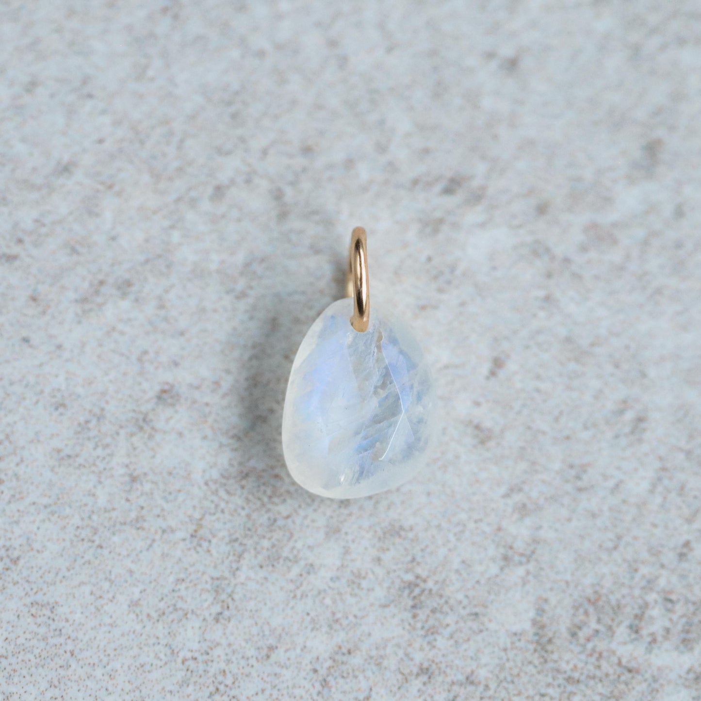 Rainbow Moonstone pendant necklace in 14K gold with a polished moonstone gemstone, elegant and natural jewelry piece.