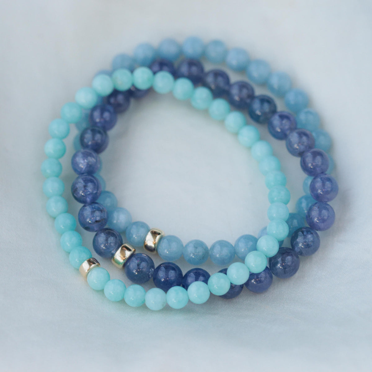 Peruvian Amazonite bracelet with 5mm beads from Earthly Abundance, featuring polished blue-green stones on an elastic band.