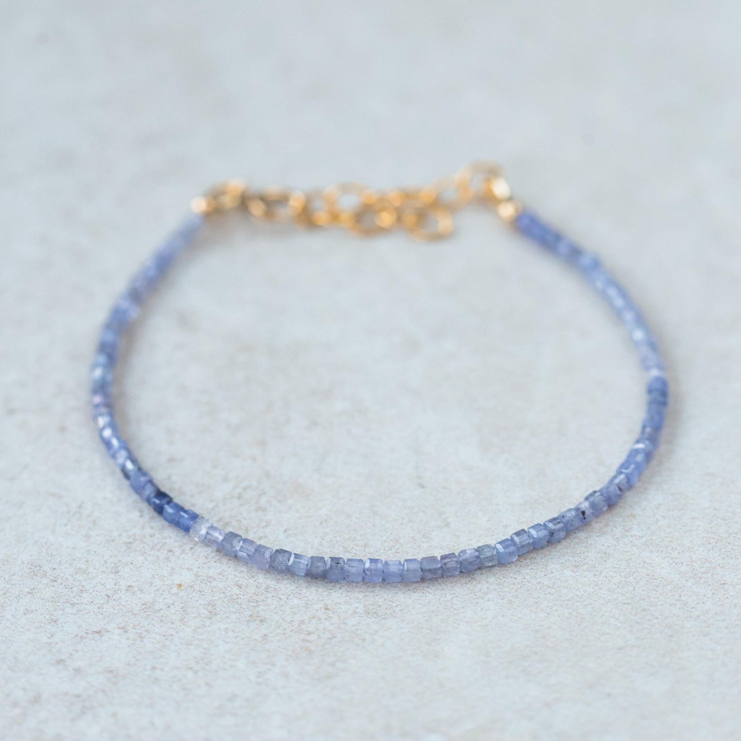 Cube-cut gemstone bracelet with 14K gold setting by Earthly Abundance, showcasing sparkling geometric gemstone beads.
