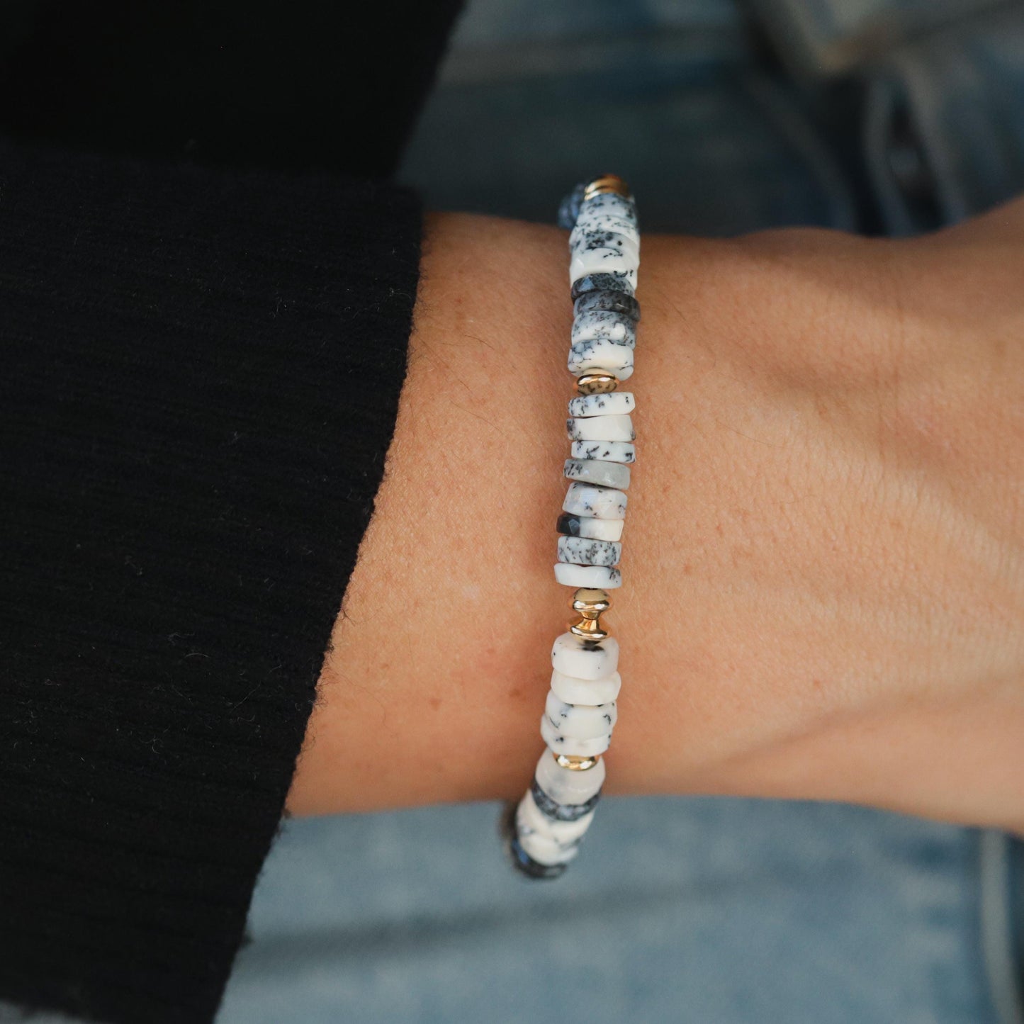 Dendrite Opal bracelet by Earthly Abundance featuring polished gemstone beads on an elastic stretch band.