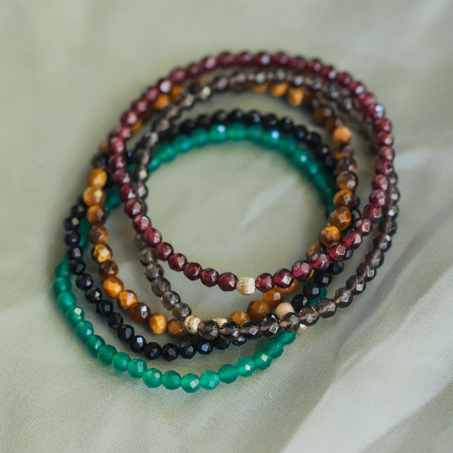 Green Onyx bracelet from Earthly Abundance featuring polished green onyx beads strung together with a secure clasp.