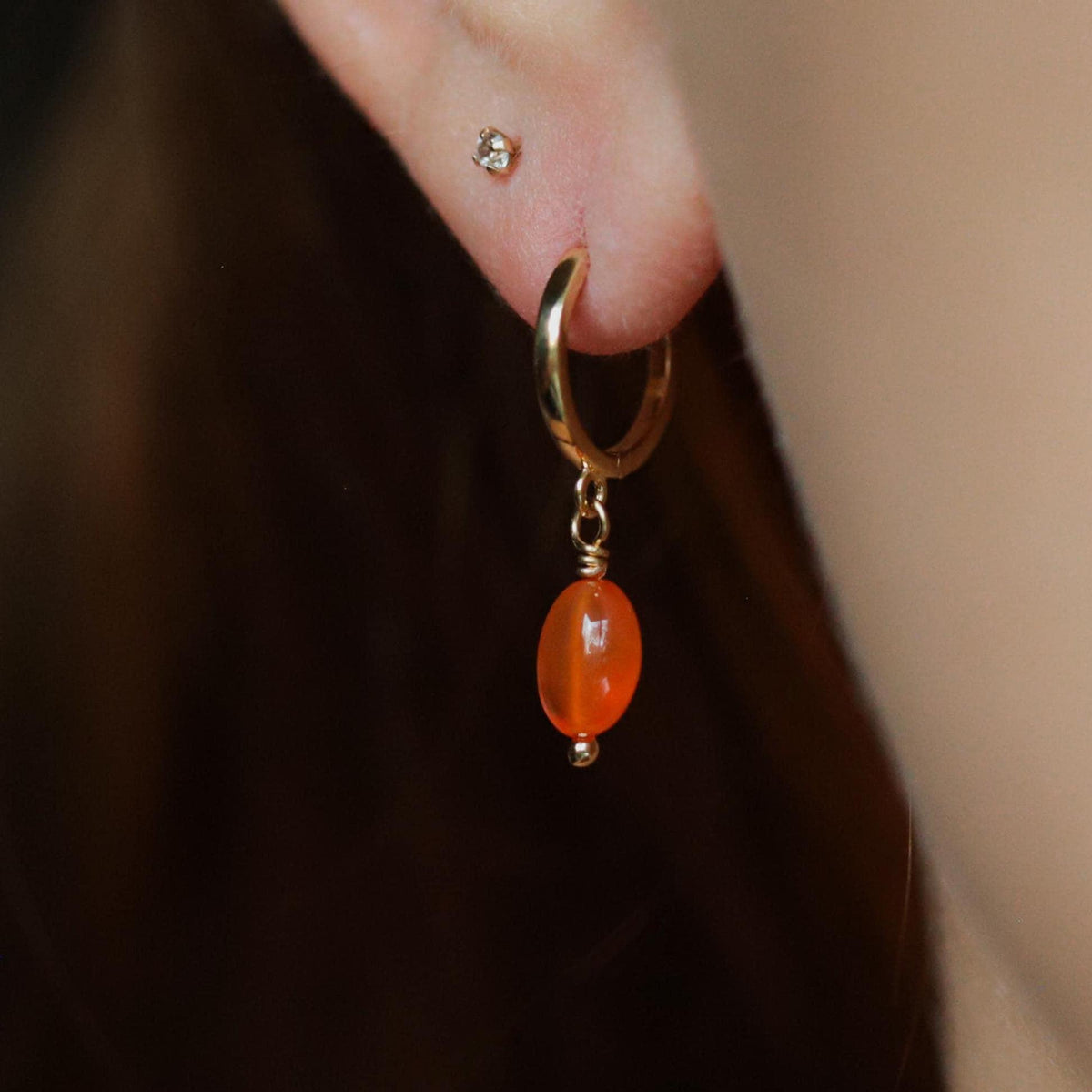 Carnelian glow hoops by Earthly Abundance featuring vibrant orange-red gemstone earrings with a hoop design.