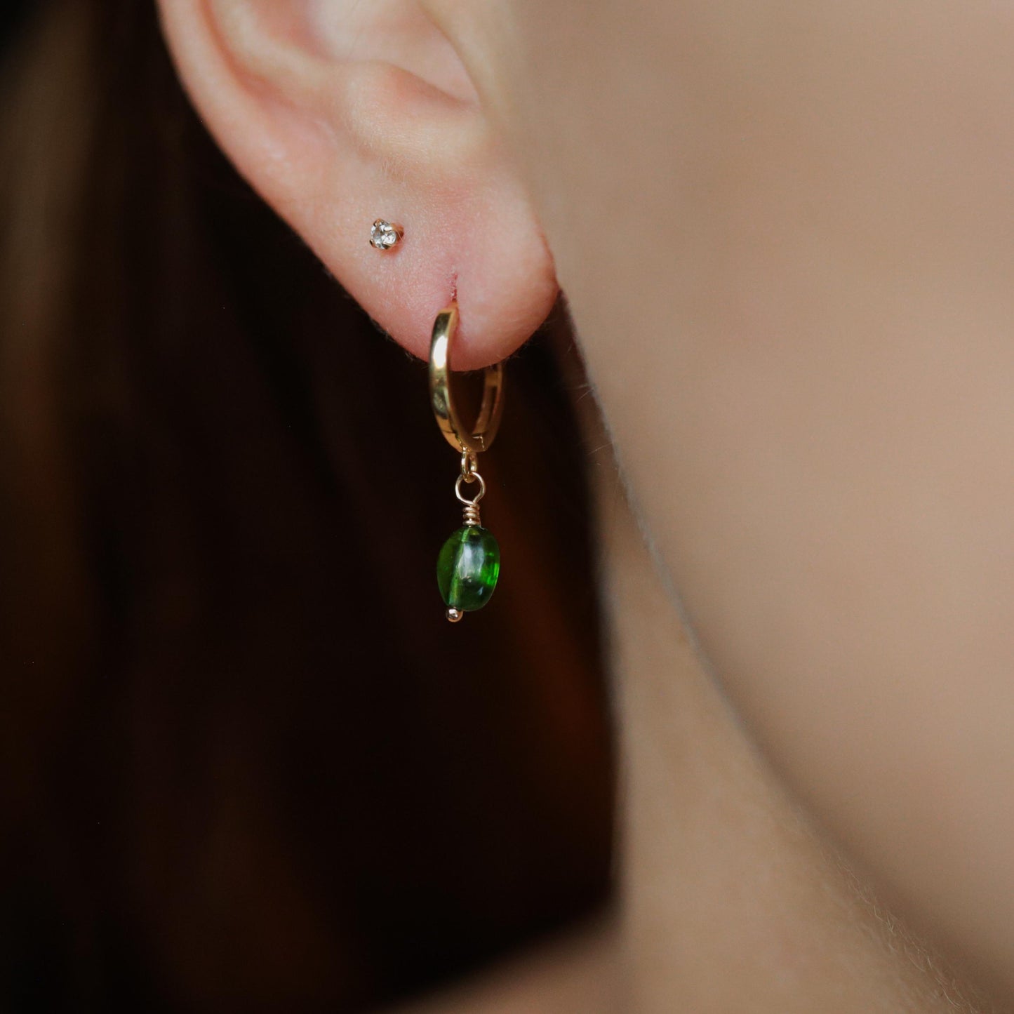 Chrome diopside hoop earrings in 14K gold, featuring vibrant green gemstones set in elegant gold hoops.