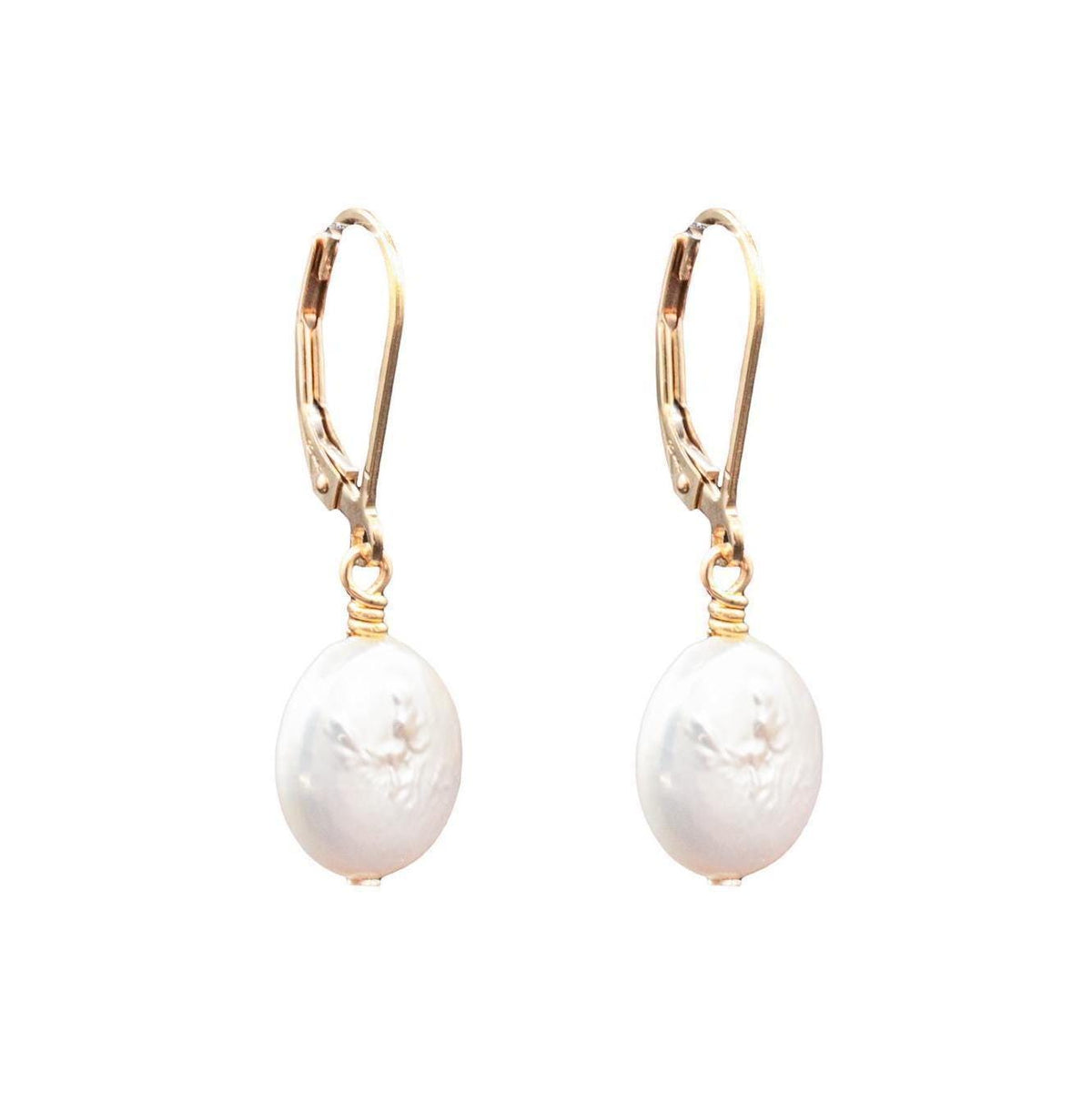 Freshwater disc pearl earrings in 14K gold from Earthly Abundance, featuring elegant white pearls on gold hooks.