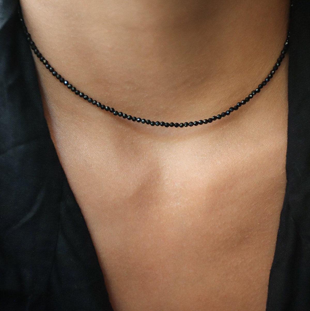 Black Spinel necklace from Earthly Abundance Jewelry featuring a string of faceted black spinel beads on a silver chain.