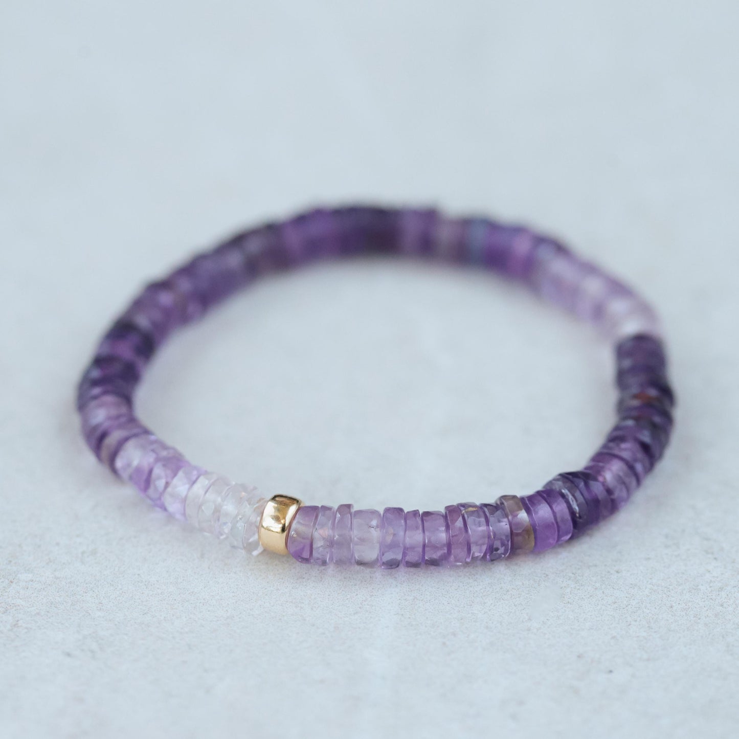 Radiant Ombré Amethyst Heishi bracelet by Earthly Abundance featuring colorful, layered amethyst beads on a flexible stretch band