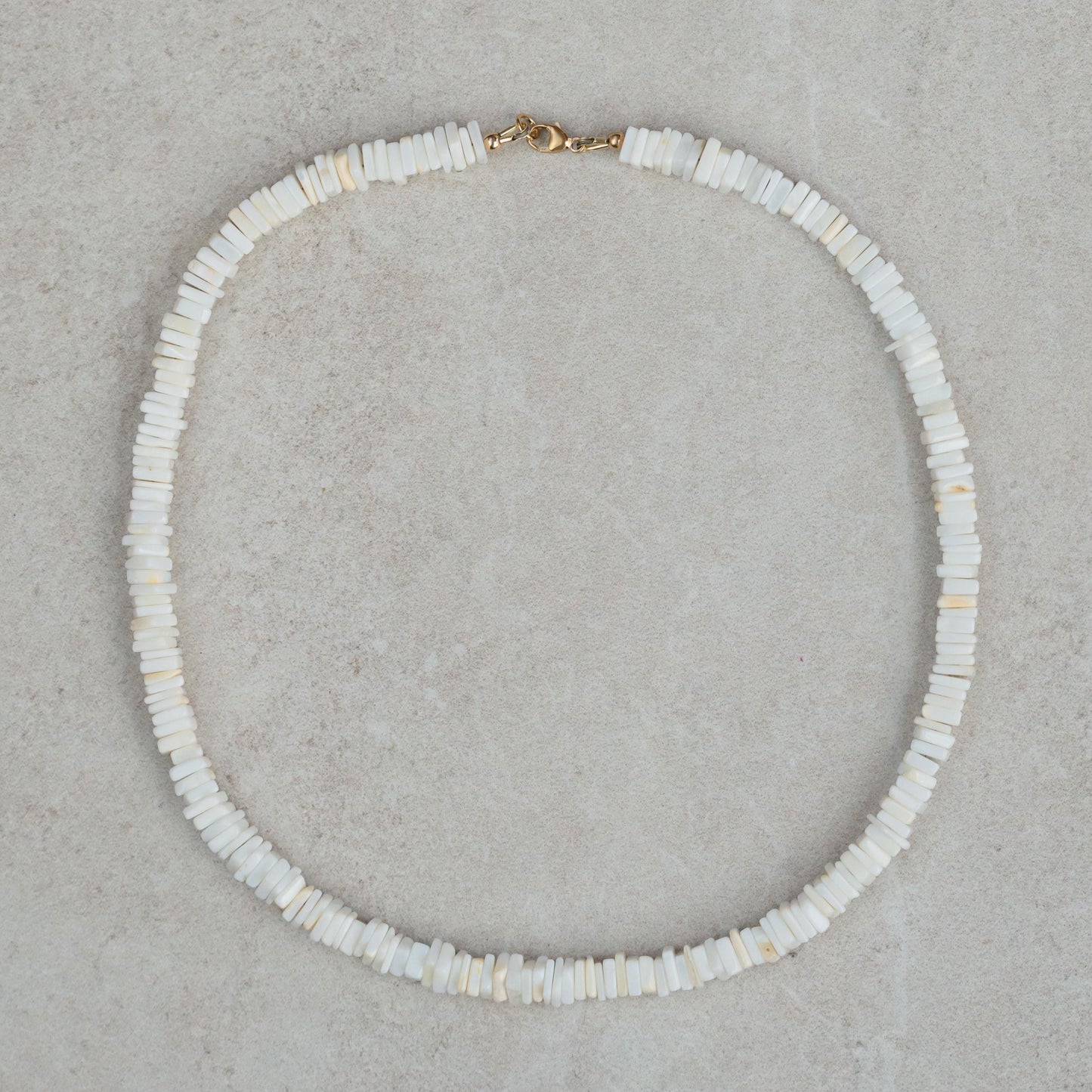 White opal necklace featuring coastal-inspired design from Earthly Abundance, with delicate chain and shimmering gemstone pendant.