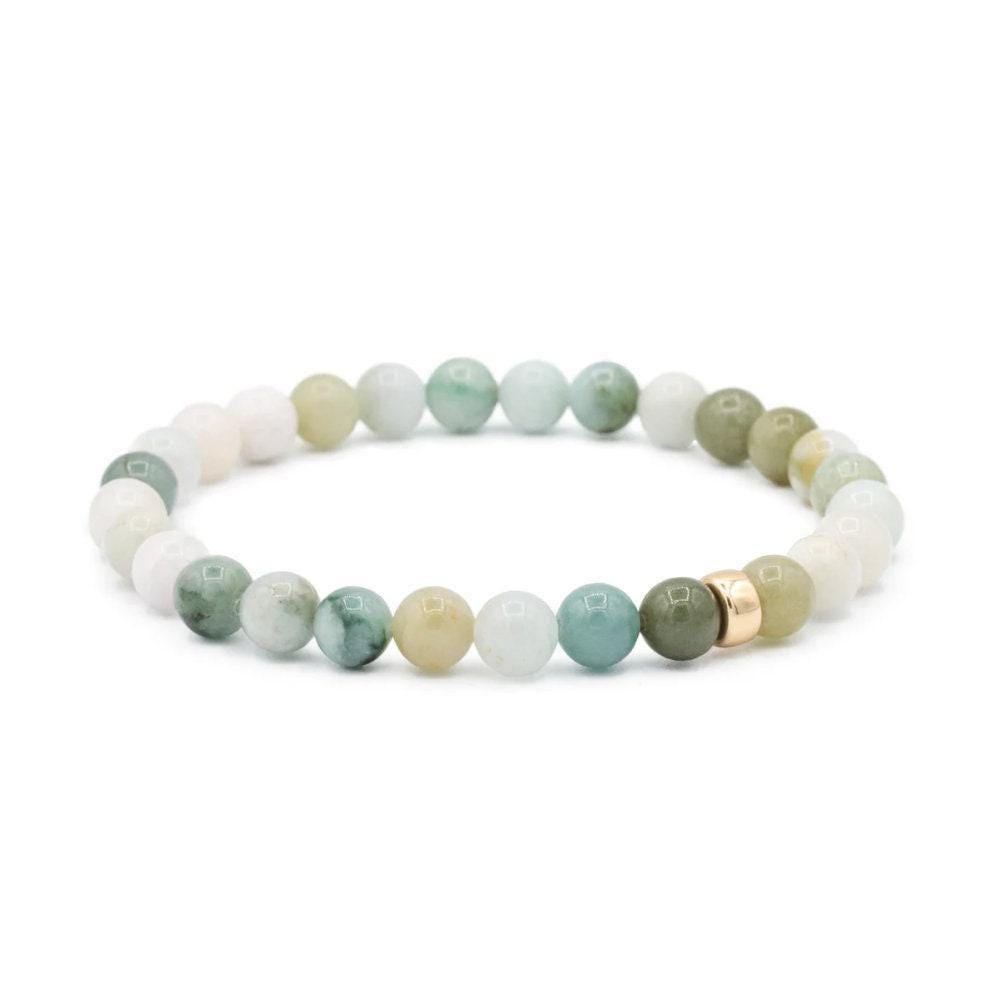 Burmese Jade 6mm gemstone beads from Earthly Abundance showcasing smooth, polished green jade round beads.