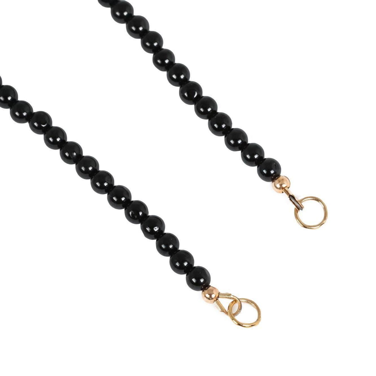 Black Tourmaline carabiner from Earthly Abundance featuring a polished black tourmaline stone attached to a metal clip
