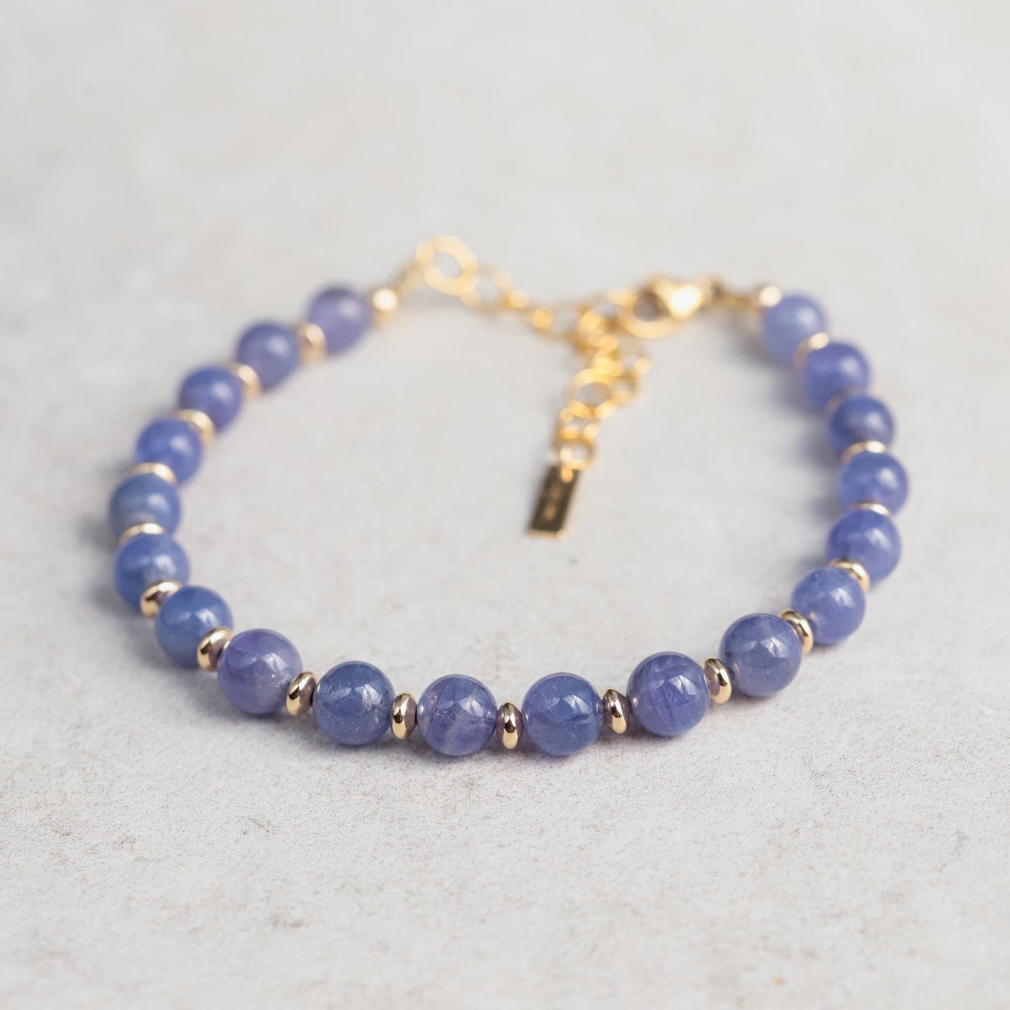 Elegant Tanzanite bracelet by Earthly Abundance featuring deep blue and purple Tanzanite gemstones on a delicate silver chain.
