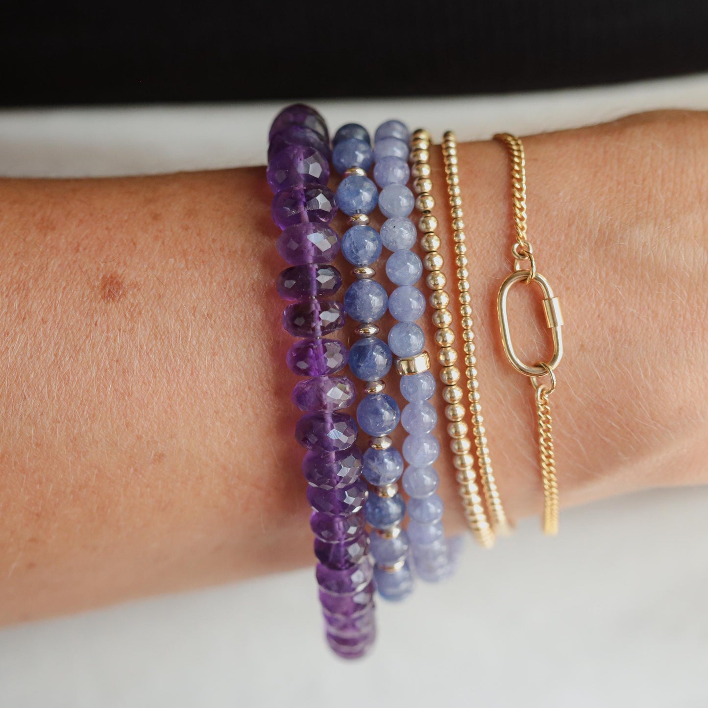 Earthly Abundance Tanzanite bracelet featuring vibrant blue-violet tanzanite gemstones on a delicate silver chain